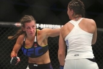 Jul 25, 2015; Chicago, IL, USA; Jessica Eye (blue gloves) fights against Miesha Tate (red gloves) during UFC Fight Night at United Center. Mandatory Credit: Dennis Wierzbicki-USA TODAY Sports