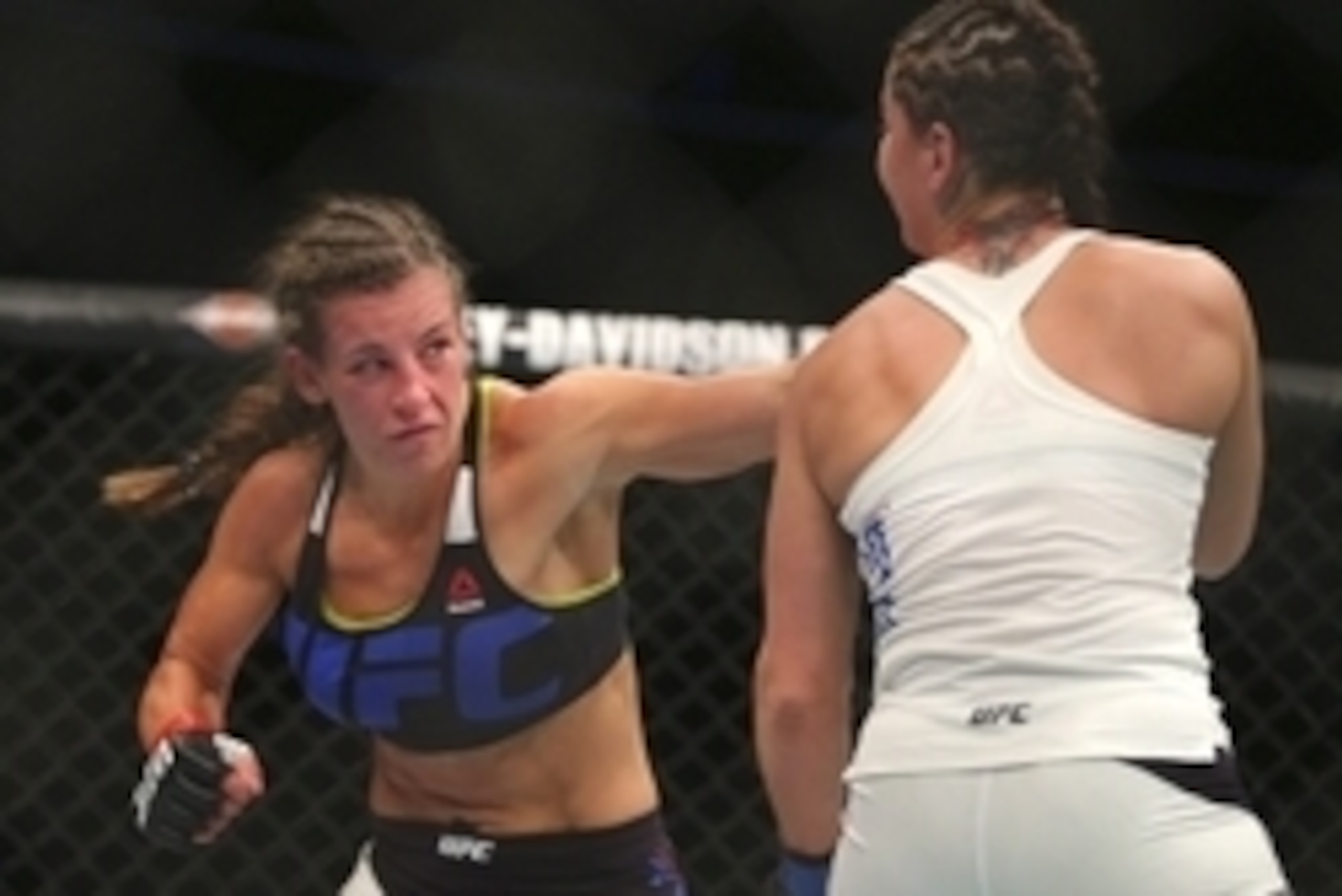 Jul 25, 2015; Chicago, IL, USA; Jessica Eye (blue gloves) fights against Miesha Tate (red gloves) during UFC Fight Night at United Center. Mandatory Credit: Dennis Wierzbicki-USA TODAY Sports Jul 25, 2015; Chicago, IL, USA; Jessica Eye (blue gloves) fights against Miesha Tate (red gloves) during UFC Fight Night at United Center. Mandatory Credit: Dennis Wierzbicki-USA TODAY Sports