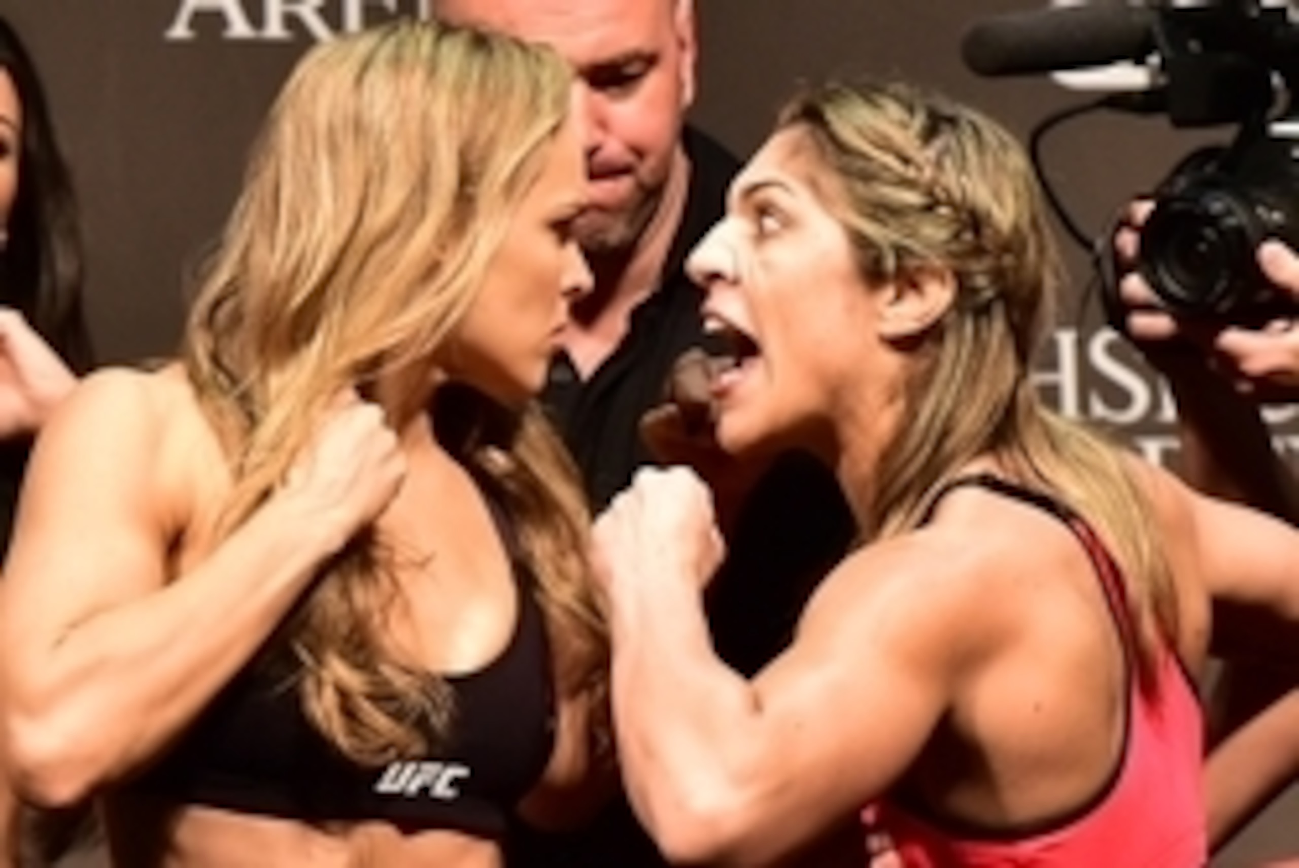 Jul 31, 2015; Rio de Janeiro, RJ, Brazil; Ronda Rousey  (left) and Bethe Correia (right) face off during weigh-ins for UFC 190 at HSBC Arena. Mandatory Credit: Jason Silva-USA TODAY Sports