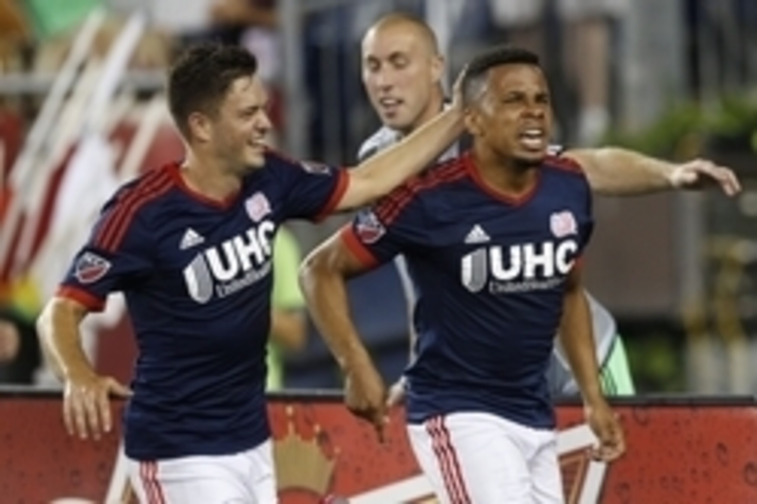 Aug 1, 2015; Foxborough, MA, USA; New England Revolution forward Charlie Davies (9) celebrates with midfielder Kelyn Rowe (11) after scoring his second goal of the match during the second half against the Toronto FC at Gillette Stadium.  The New England R