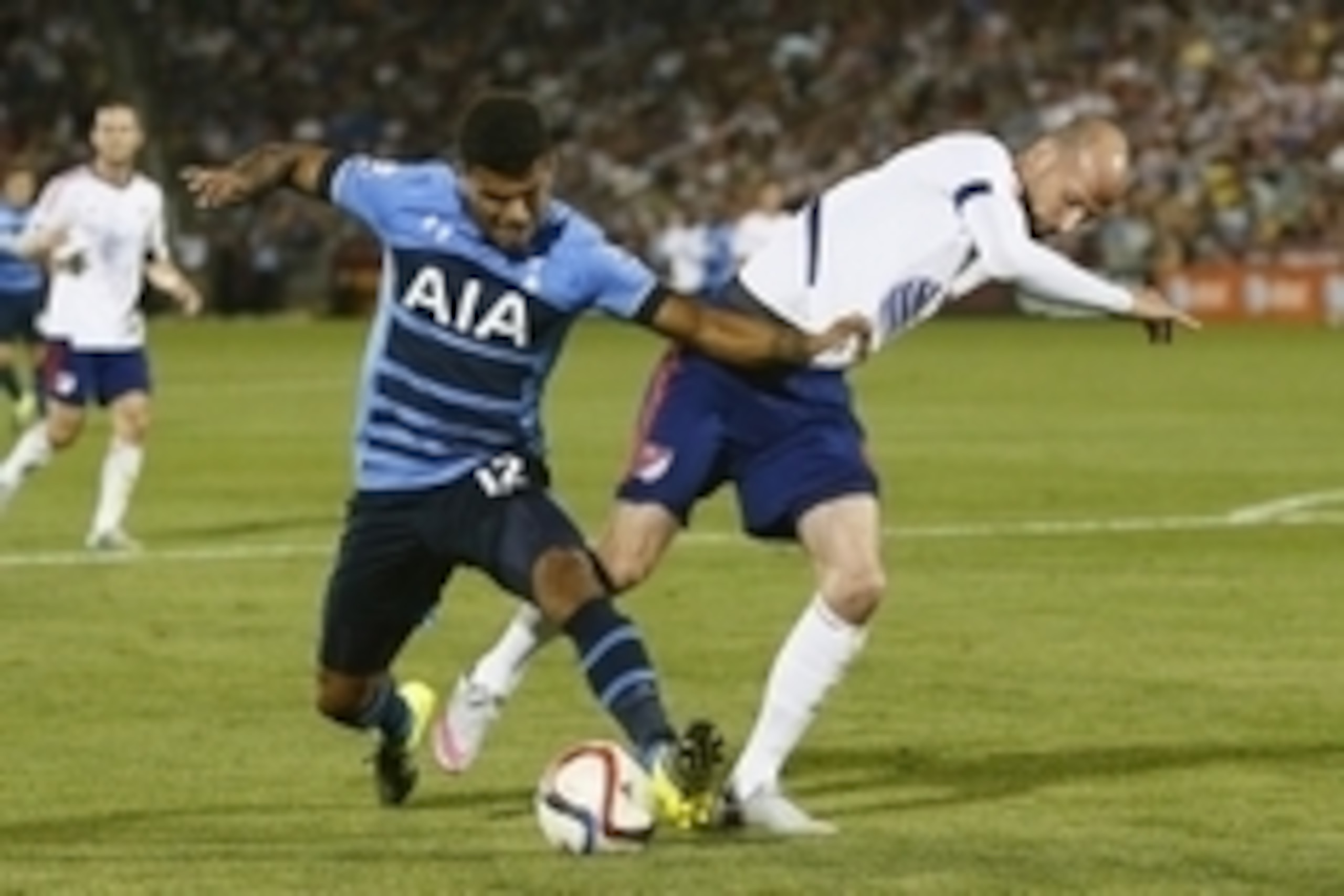 Jul 29, 2015; Denver, CO, USA; Tottenham Hotspur defender DeAndre Yedlin (12) and MLS All Stars defender Laurent Ciman (6) of the Montreal Impact battle for the ball during the second half of the 2015 MLS All Star Game at Dick's Sporting Goods Park. MLS A