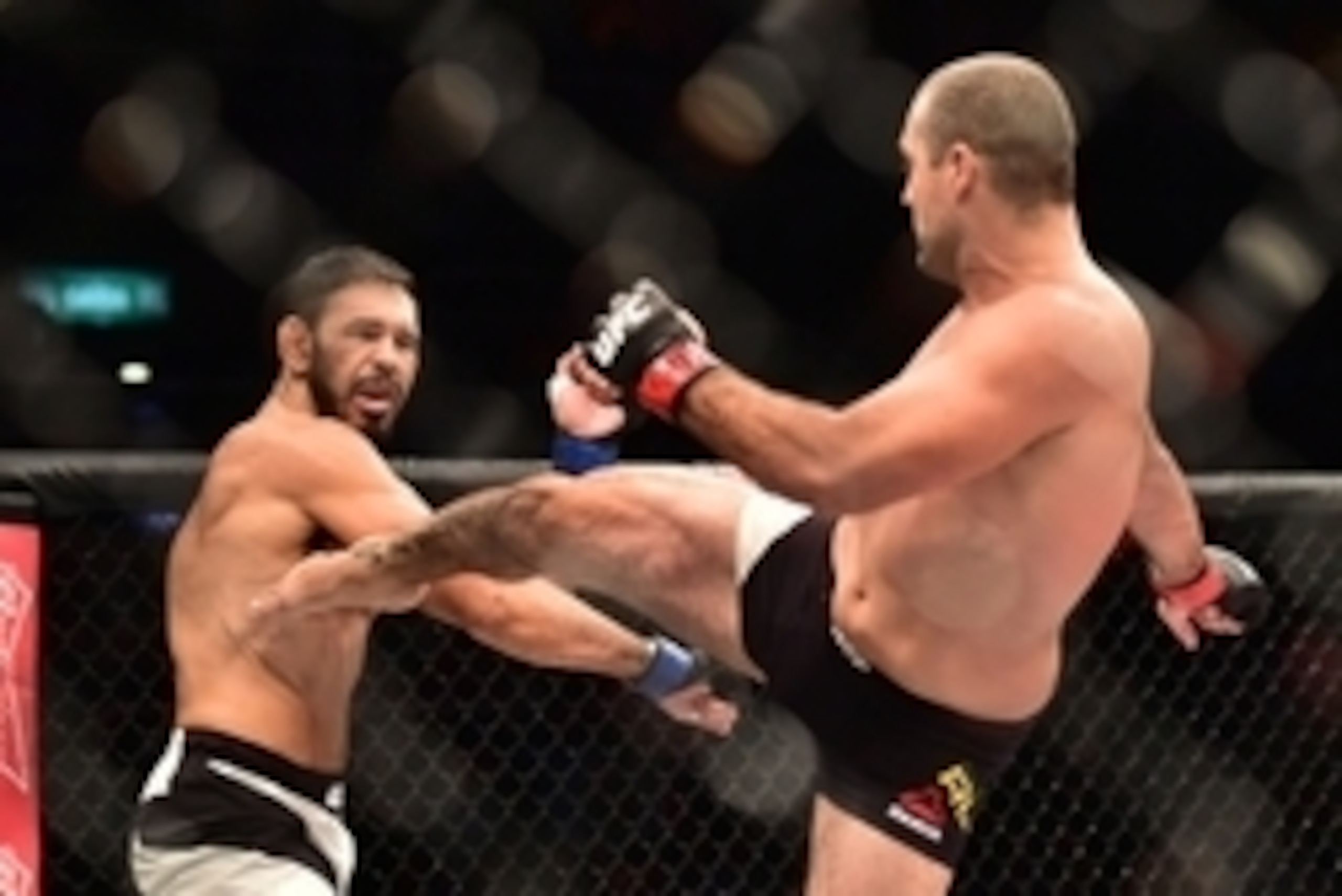 Aug 1, 2015; Rio de Janeiro, RJ, Brazil; Mauricio  Shogun  Rua (red gloves) fights Antonio Rogerio  Minotouro  Nogueira (blue gloves) during UFC 190 at HSBC Arena. Mandatory Credit: Jason Silva-USA TODAY Sports