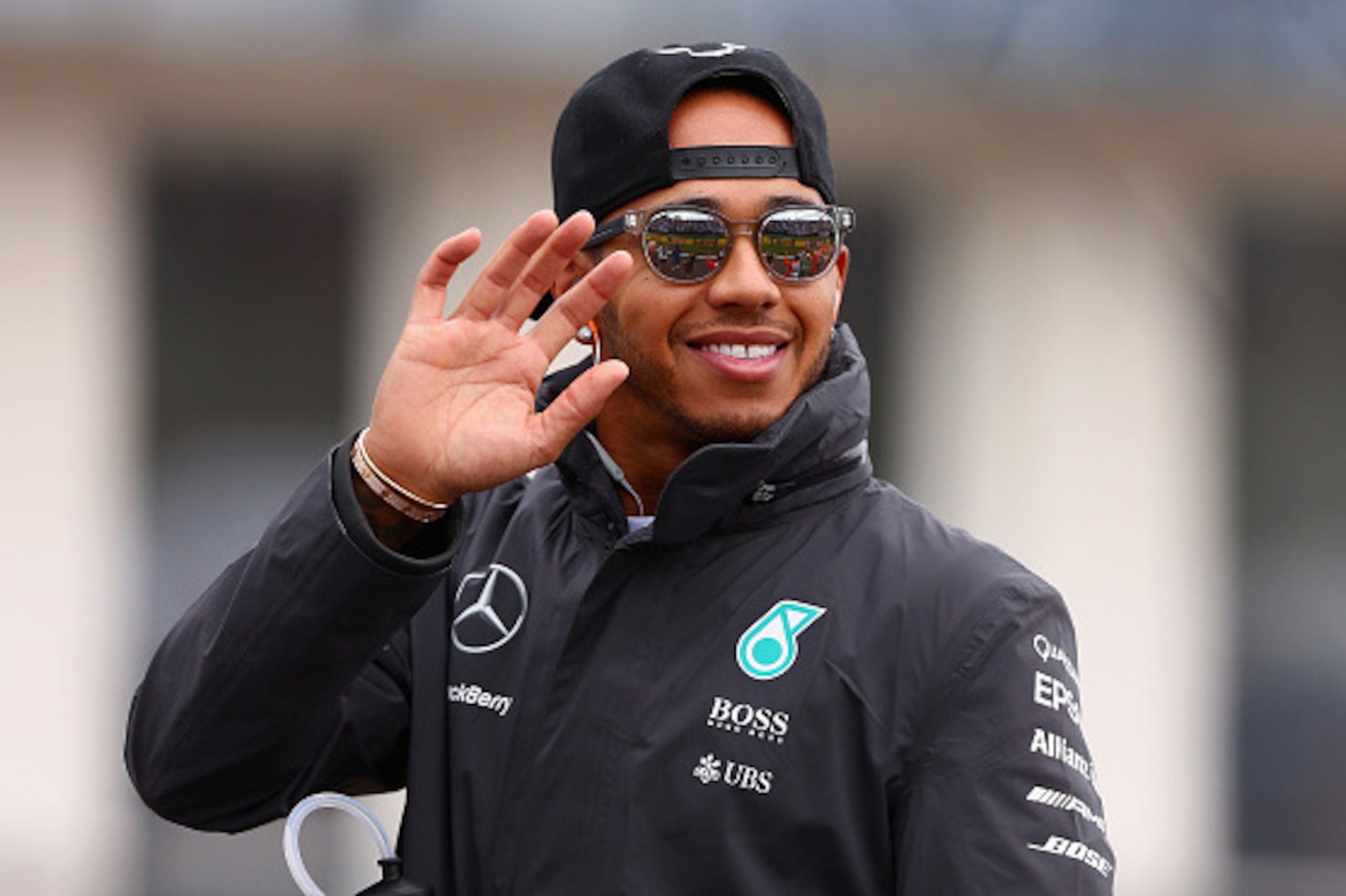 BUDAPEST, HUNGARY - JULY 26:  Lewis Hamilton of Great Britain and Mercedes GP waves to fans during the drivers' parade before the Formula One Grand Prix of Hungary at Hungaroring on July 26, 2015 in Budapest, Hungary.  (Photo by Clive Mason/Getty Images)