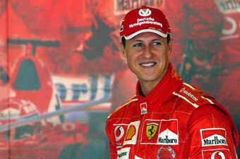 MELBOURNE, AUSTRALIA:  Formula One World Champion Michael Schumacher of Germany smiles in the Ferrari garage ahead on the eve of the first practice session of the 2005 Australian Formula One Grand Prix in Melbourne, 03 March 2005.  Ferrari will be using t