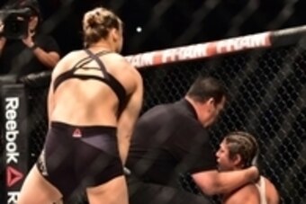 Aug 1, 2015; Rio de Janeiro, RJ, Brazil; Ronda Rousey (red gloves) reacts after knocking out Bethe Correia (blue gloves) during UFC 190 at HSBC Arena. Mandatory Credit: Jason Silva-USA TODAY Sports