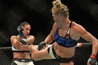 Jul 15, 2015; San Diego, CA, USA; Holly Holm (red) fights Marion Reneau (blue) during UFC Fight Night at Valley View Casino Center. Mandatory Credit: Jake Roth-USA TODAY Sports