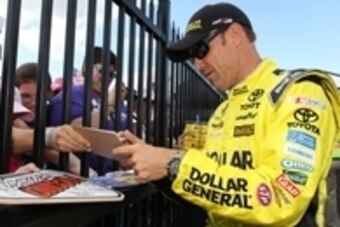 Jul 31, 2015; Long Pond, PA, USA; NASCAR Sprint Cup Series driver Matt Kenseth signs autographs during qualifying for the Windows 10 400 at Pocono Raceway. Mandatory Credit: Matthew O'Haren-USA TODAY Sports