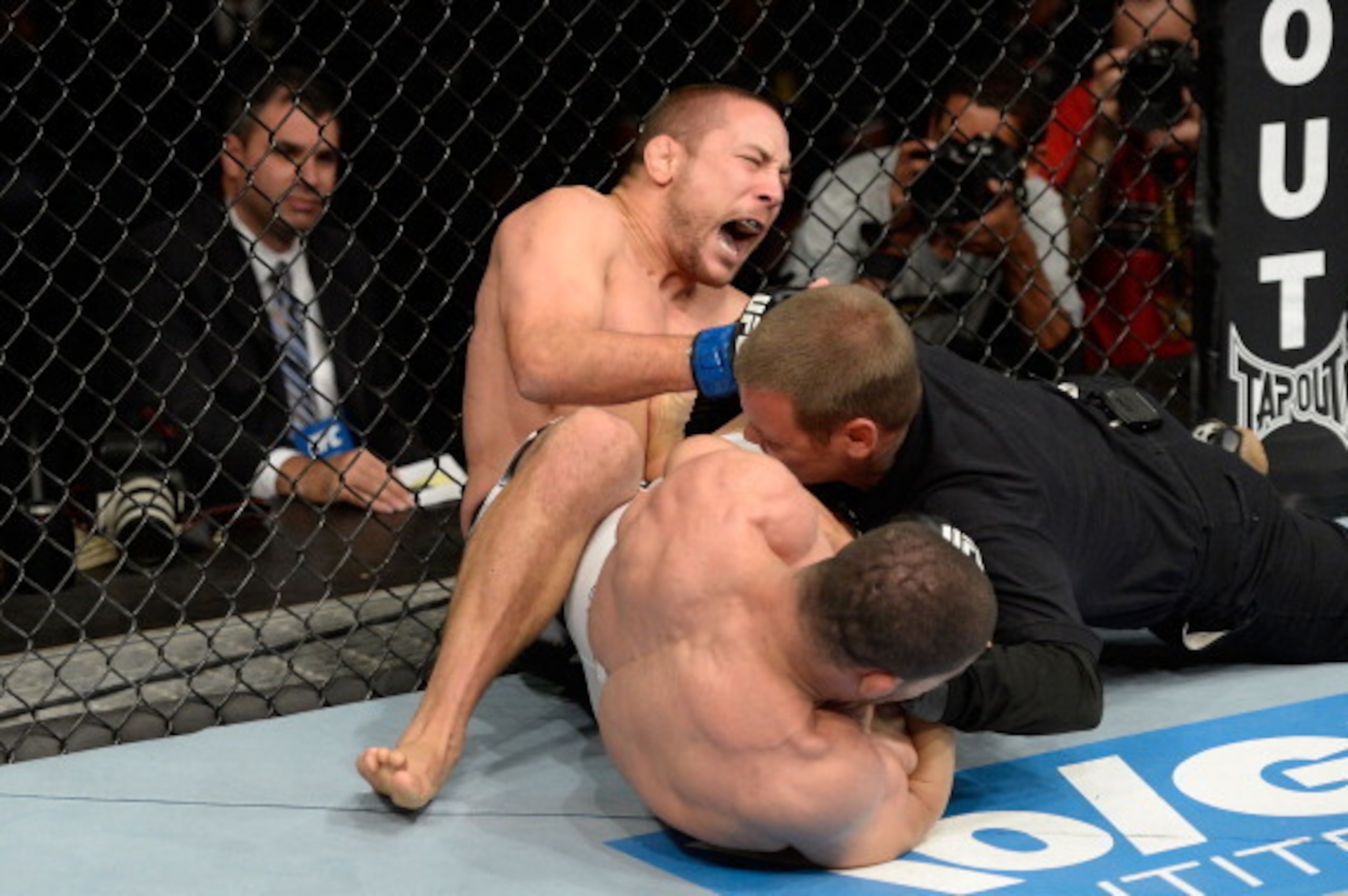 BARUERI, BRAZIL - OCTOBER 9:  (L-R) Mike Pierce screams while getting submitted by Rousimar Palhares in their welterweight bout during the UFC Fight Night event at the Ginasio Jose Correa on October 9, 2013 in Barueri, Sao Paulo, Brazil. (Photo by Jeff Bo