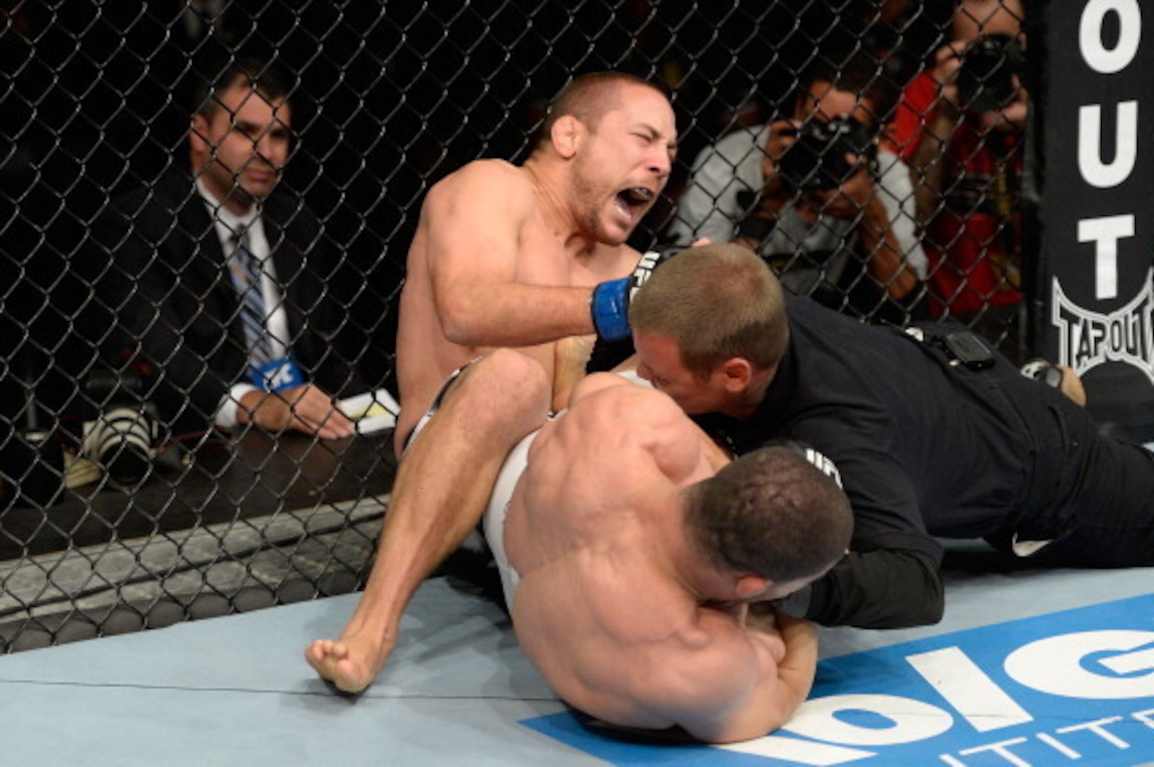 BARUERI, BRAZIL - OCTOBER 9: (L-R) Mike Pierce screams while getting submitted by Rousimar Palhares in their welterweight bout during the UFC Fight Night event at the Ginasio Jose Correa on October 9, 2013 in Barueri, Sao Paulo, Brazil. (Photo by Jeff Bo BARUERI, BRAZIL - OCTOBER 9: (L-R) Mike Pierce screams while getting submitted by Rousimar Palhares in their welterweight bout during the UFC Fight Night event at the Ginasio Jose Correa on October 9, 2013 in Barueri, Sao Paulo, Brazil. (Photo by Jeff Bo