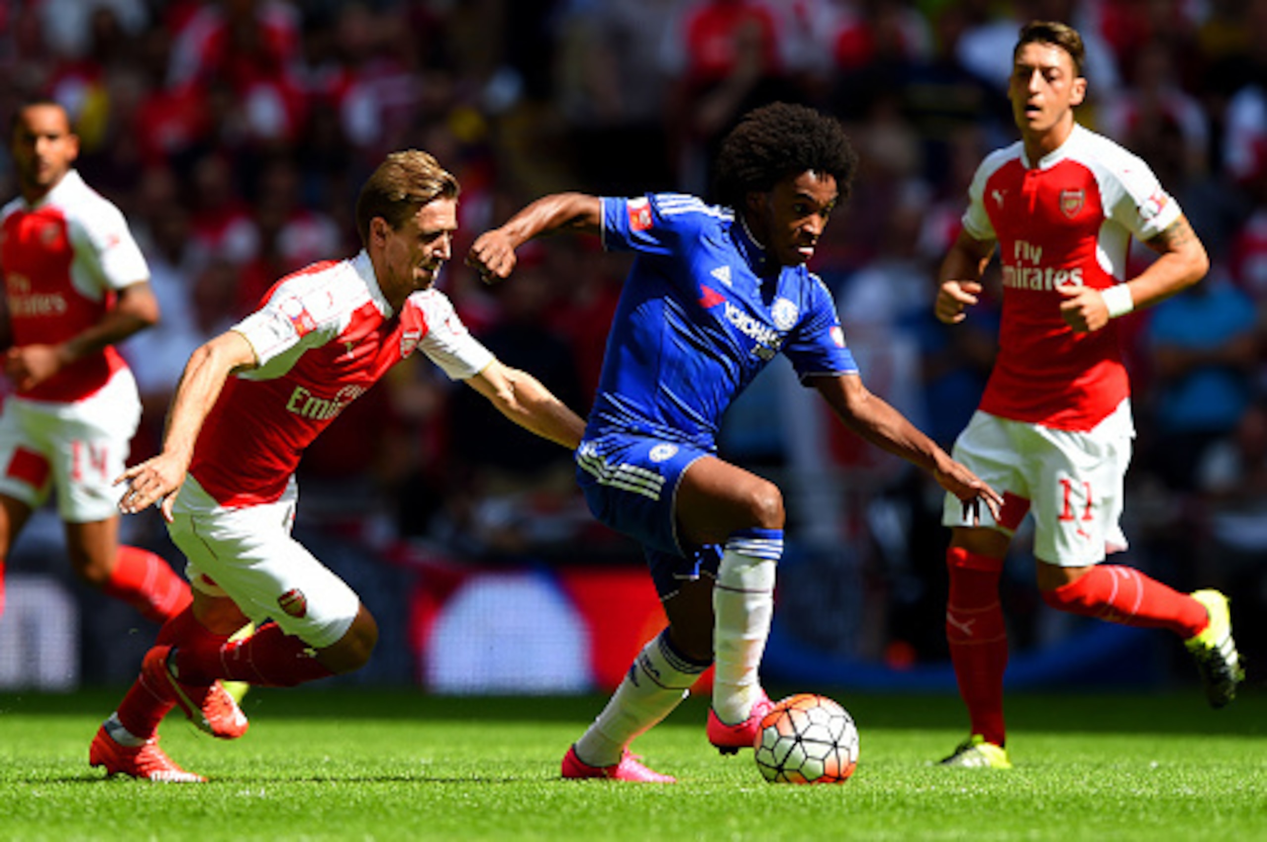 LONDON, ENGLAND - AUGUST 02:  Willian of Chelsea and Nacho Monreal of Arsenal compete for the ball during the FA Community Shield match between Chelsea and Arsenal at Wembley Stadium on August 2, 2015 in London, England.  (Photo by Shaun Botterill/Getty I