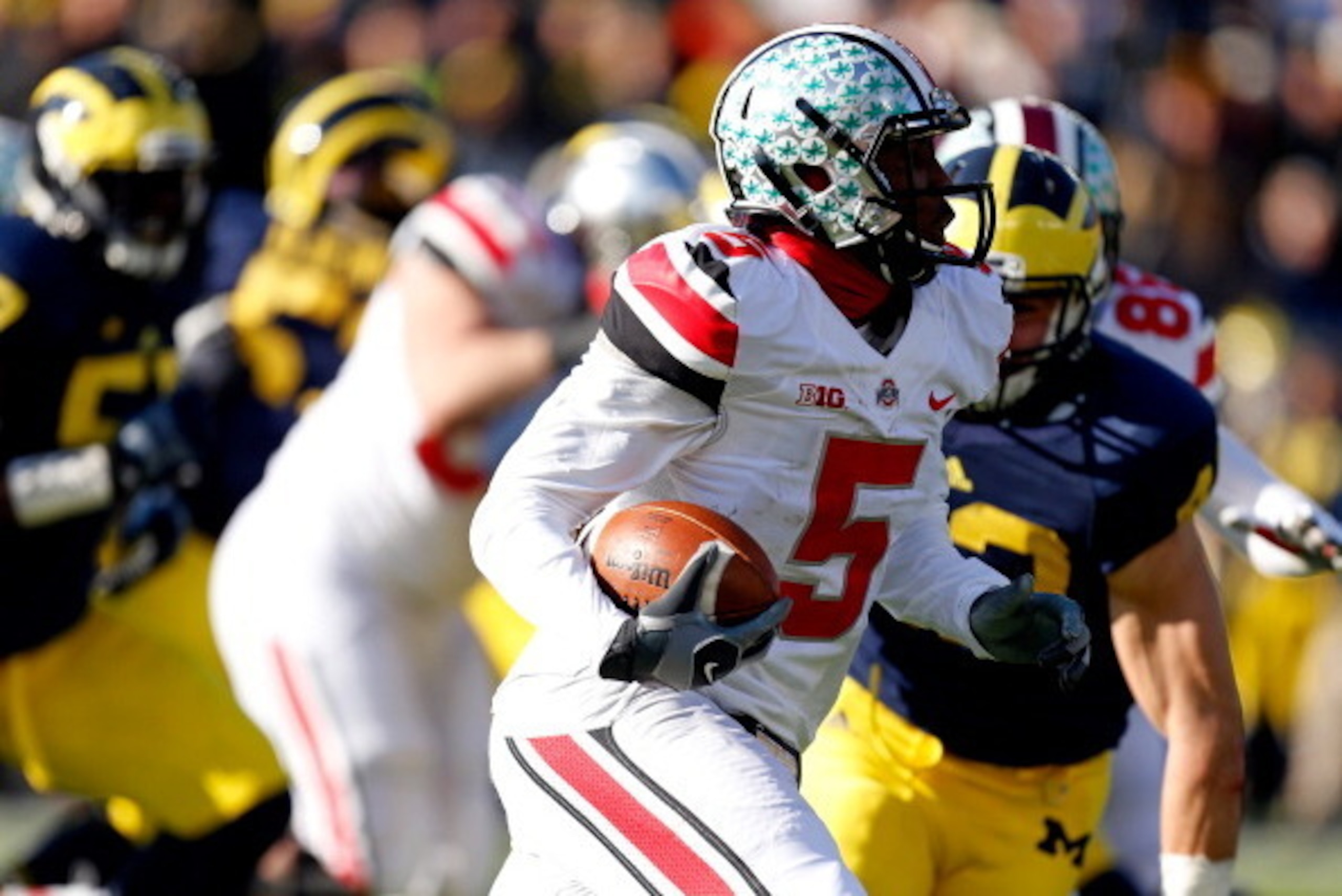 ANN ARBOR, MI - NOVEMBER 30:  Quarterback Braxton Miller #5 of the Ohio State Buckeyes runs the ball against the Michigan Wolverines during a game at Michigan Stadium on November 30, 2013 in Ann Arbor, Michigan.  (Photo by Gregory Shamus/Getty Images)