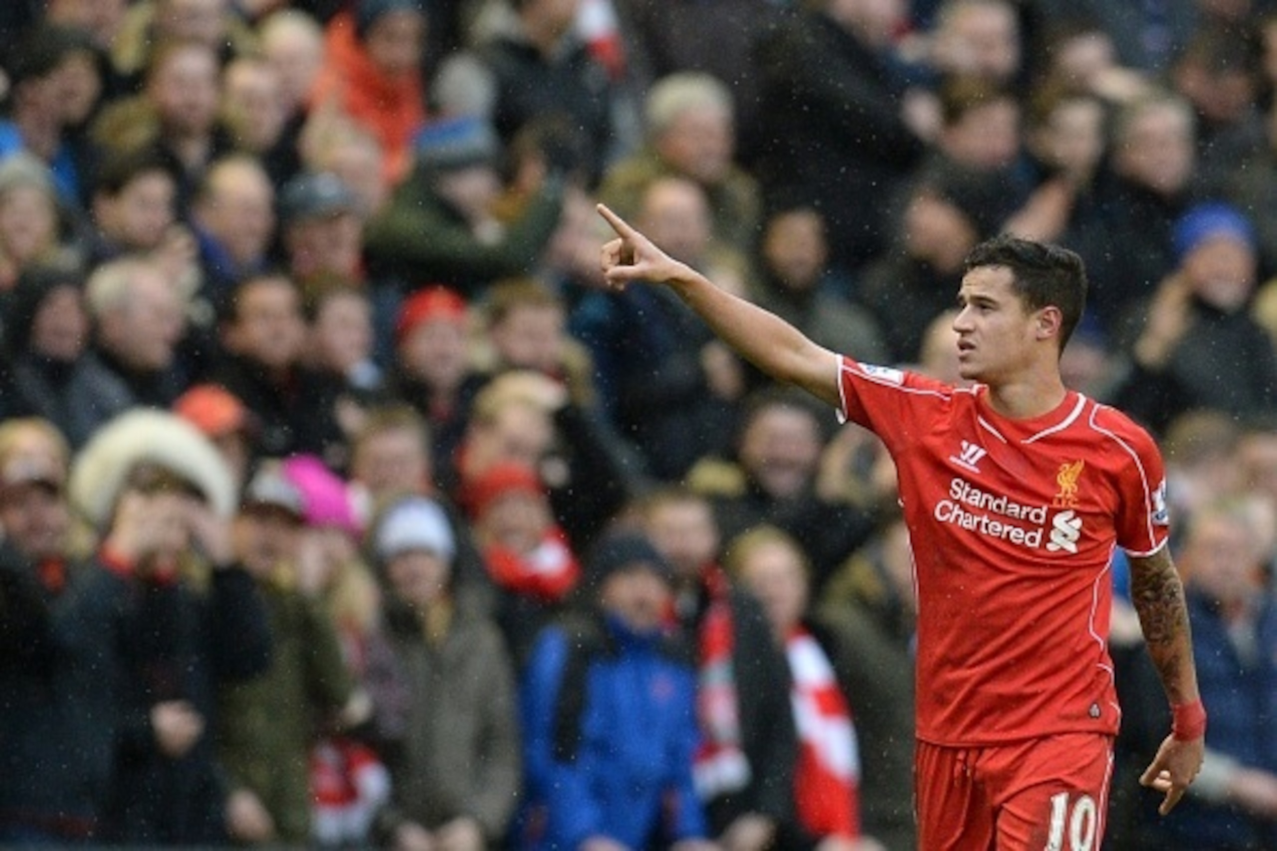 Liverpool's Brazilian midfielder Philippe Coutinho celebrates scoring their second goal during the English Premier League football match between Liverpool and Manchester City at Anfield stadium in Liverpool, north west England, on March 1, 2015. Liverpool