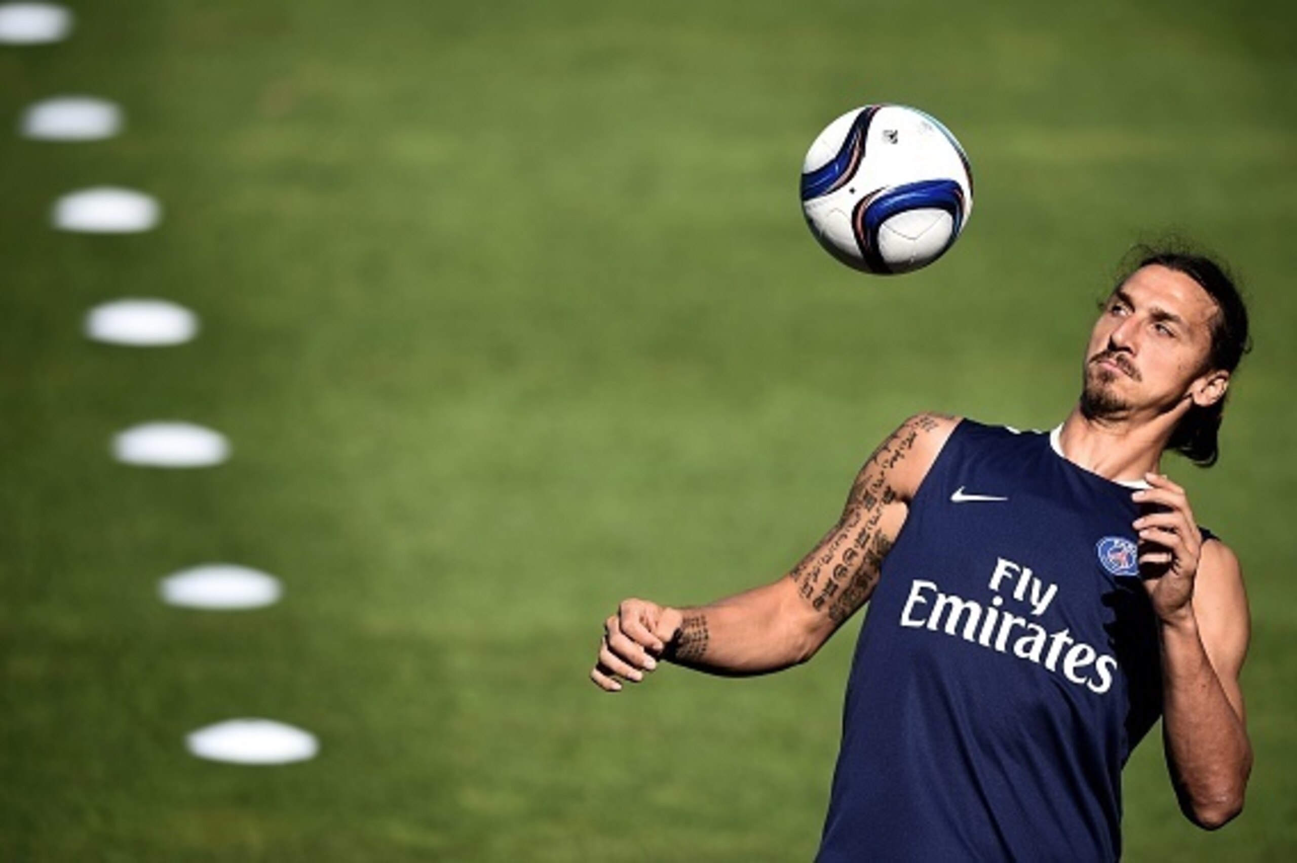 Paris Saint-Germain's Swedish forward Zlatan Ibrahimovic eyes the ball during a training session at Saputo stadium in Montreal on July 31, 2015 on the eve of the French Trophy of Champions football match against Lyon.  AFP PHOTO / FRANCK FIFE        (Phot
