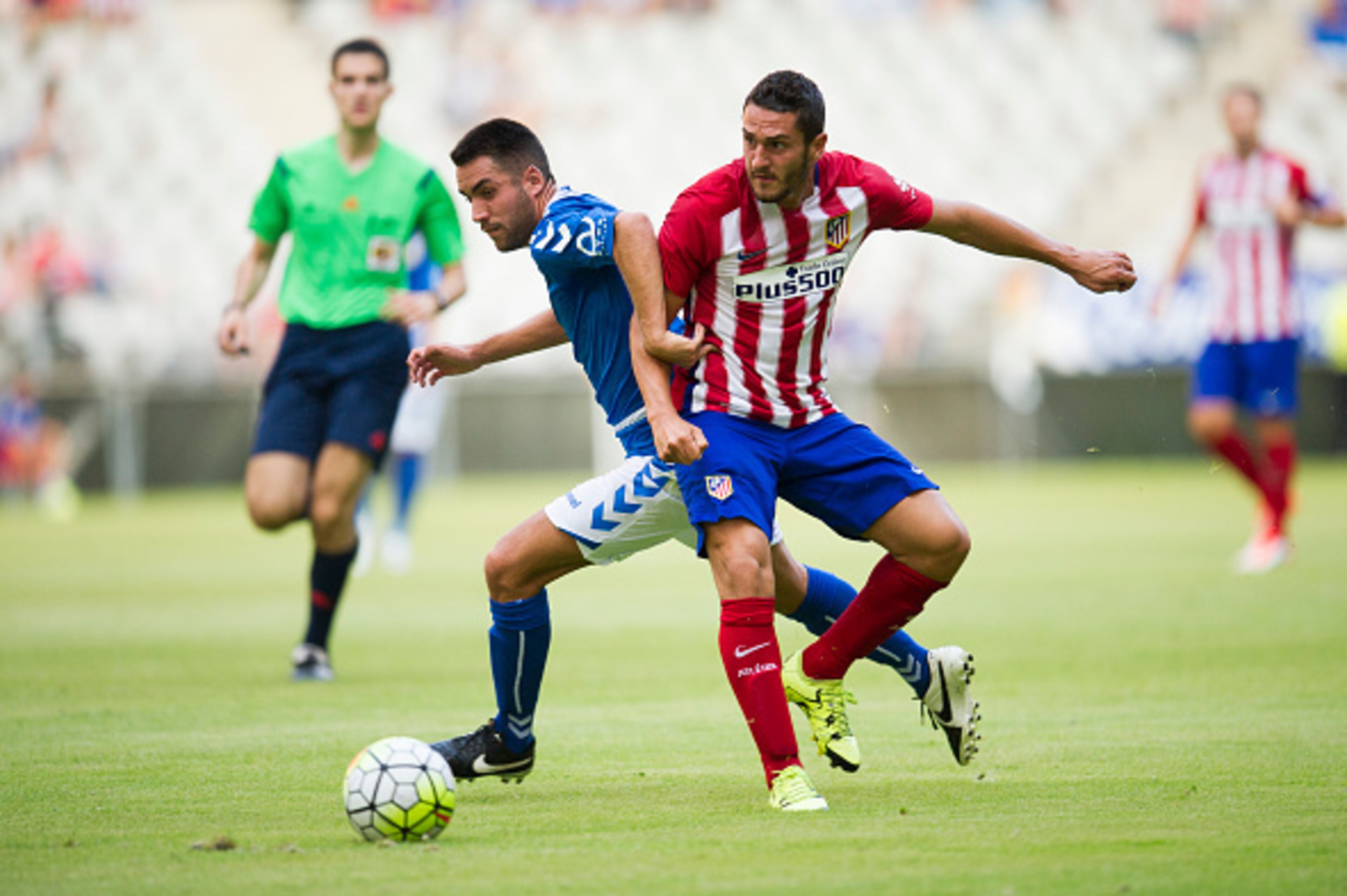 OVIEDO, SPAIN - JULY 28: Jorge Resurreccion 'Koke' of Club Atletico de Madrid duels for the ball with Miguel Linares of Real Oviedo during a pre season friendly match between Real Oviedo and Club Atletico de Madrid at Carlos Tartiere on July 28, 2015 in O