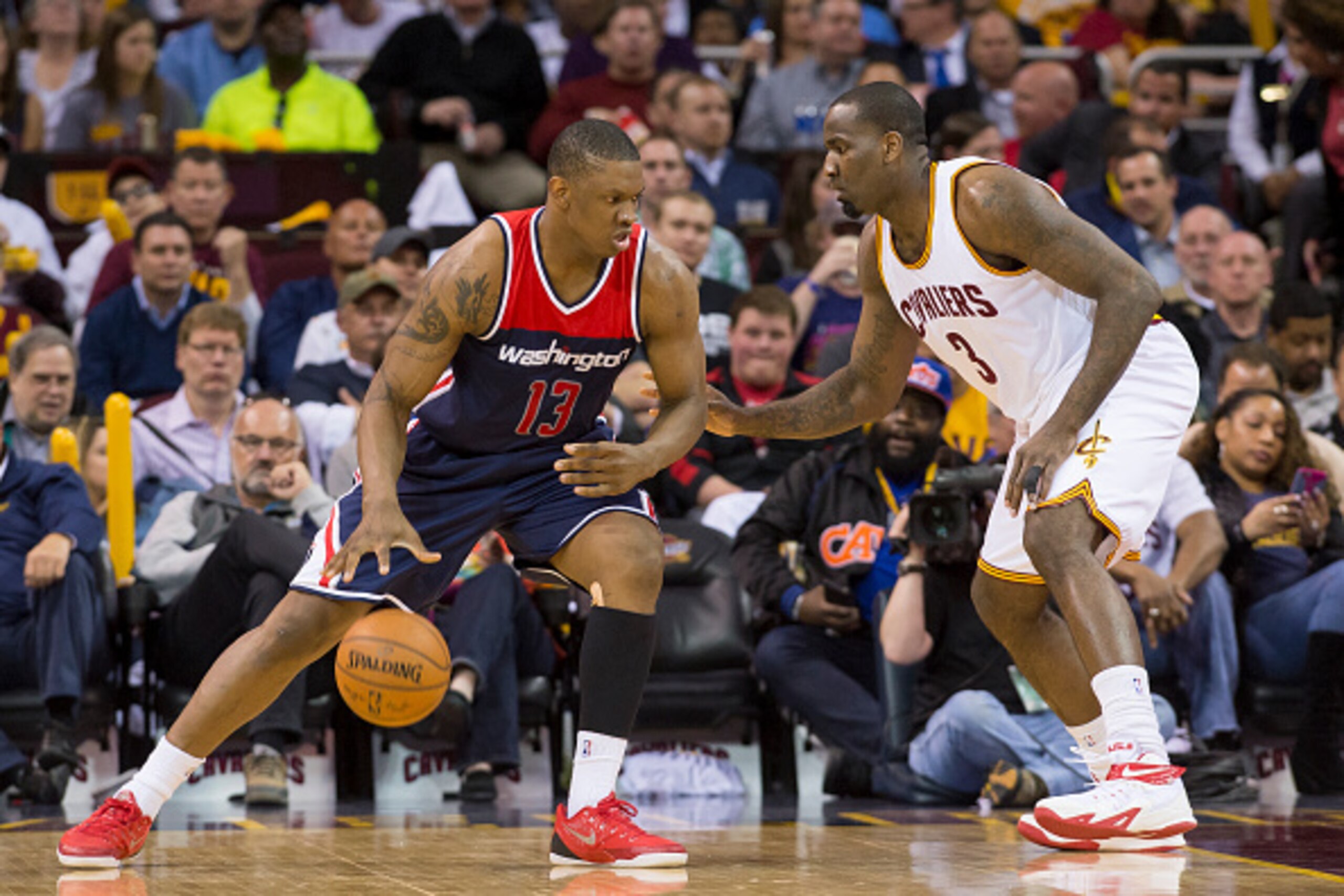 CLEVELAND, OH - APRIL 15: Kevin Seraphin #13 of the Washington Wizards posts up against Kendrick Perkins #3 of the Cleveland Cavaliers during the second half at Quicken Loans Arena on April 15, 2015 in Cleveland, Ohio. The Cavaliers defeated the Wizards 1