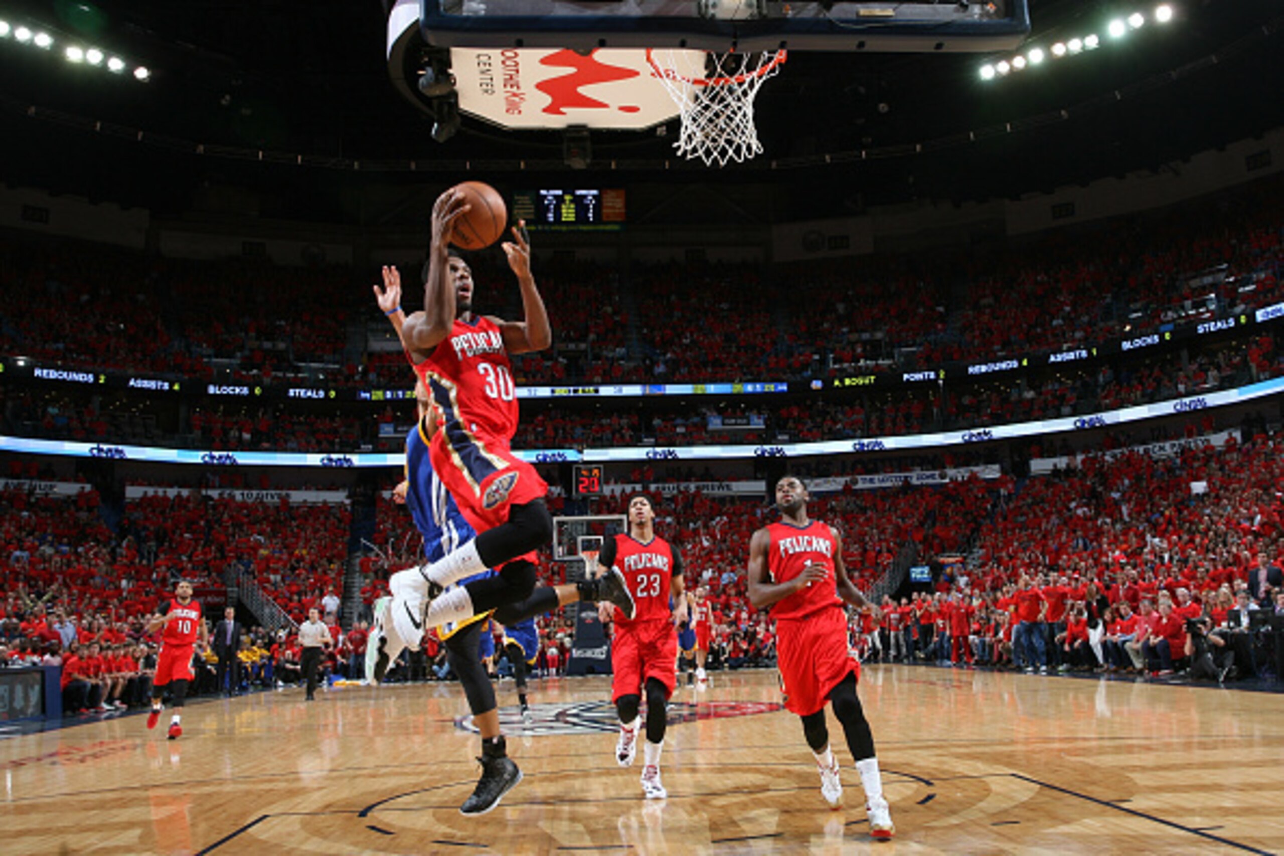 NEW ORLEANS, LA - APRIL 23: Norris Cole #30 of the New Orleans Pelicans shoots against the Golden State Warriors in Game Three of the Western Conference Quarterfinals during the NBA Playoffs on April 23, 2015 at Smoothie King Center in New Orleans, Louisi