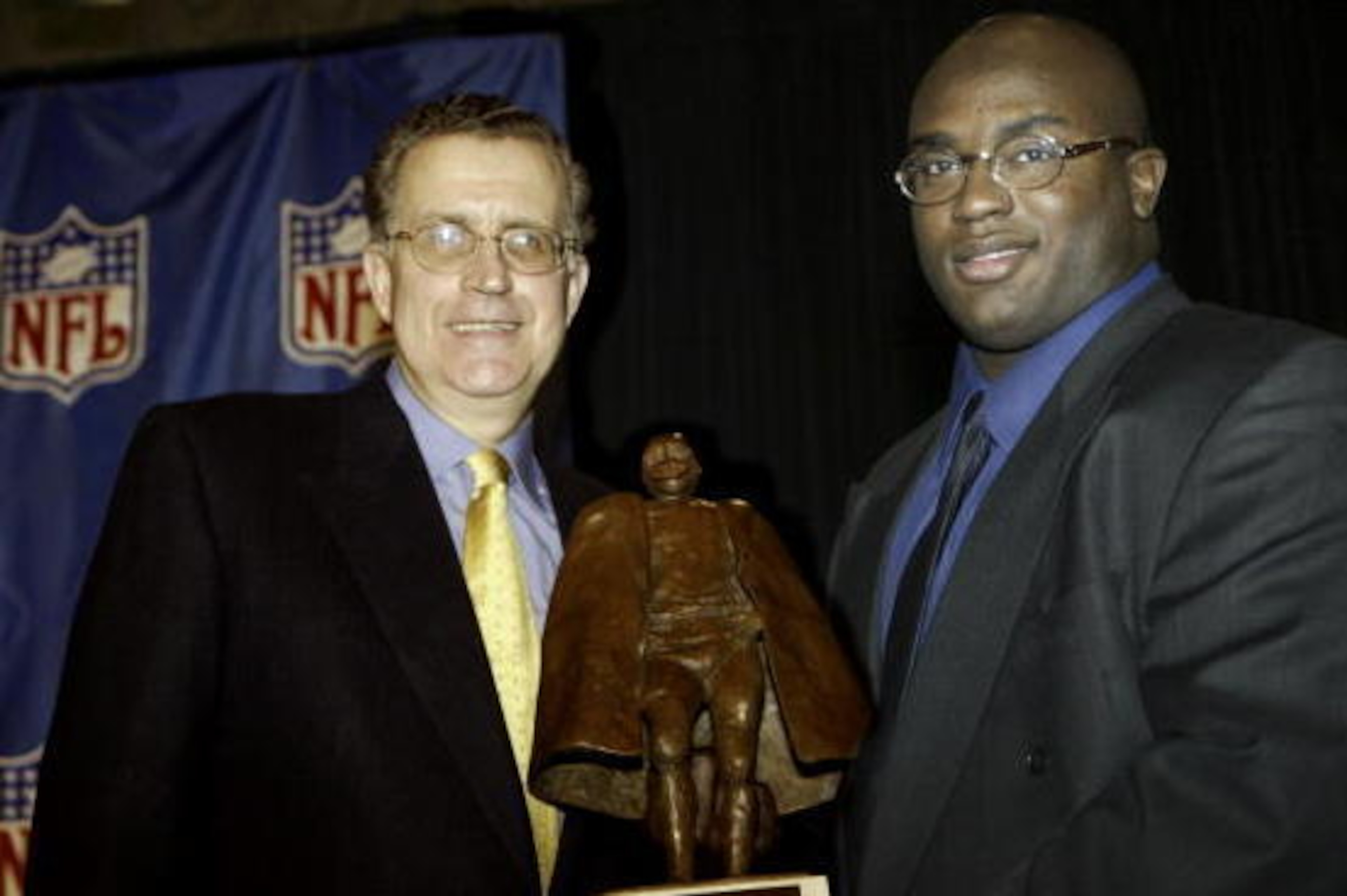 NFL Commissioner Paul Tagliabue with the 2003 NFL Man of the Year Award winner Will Shields of the Kansas City Chiefs before Super Bowl XXXVIII at Reliant Stadium in Houston, Texas on January 30, 2004.  The New England Patriots defeated the Carolina Panth