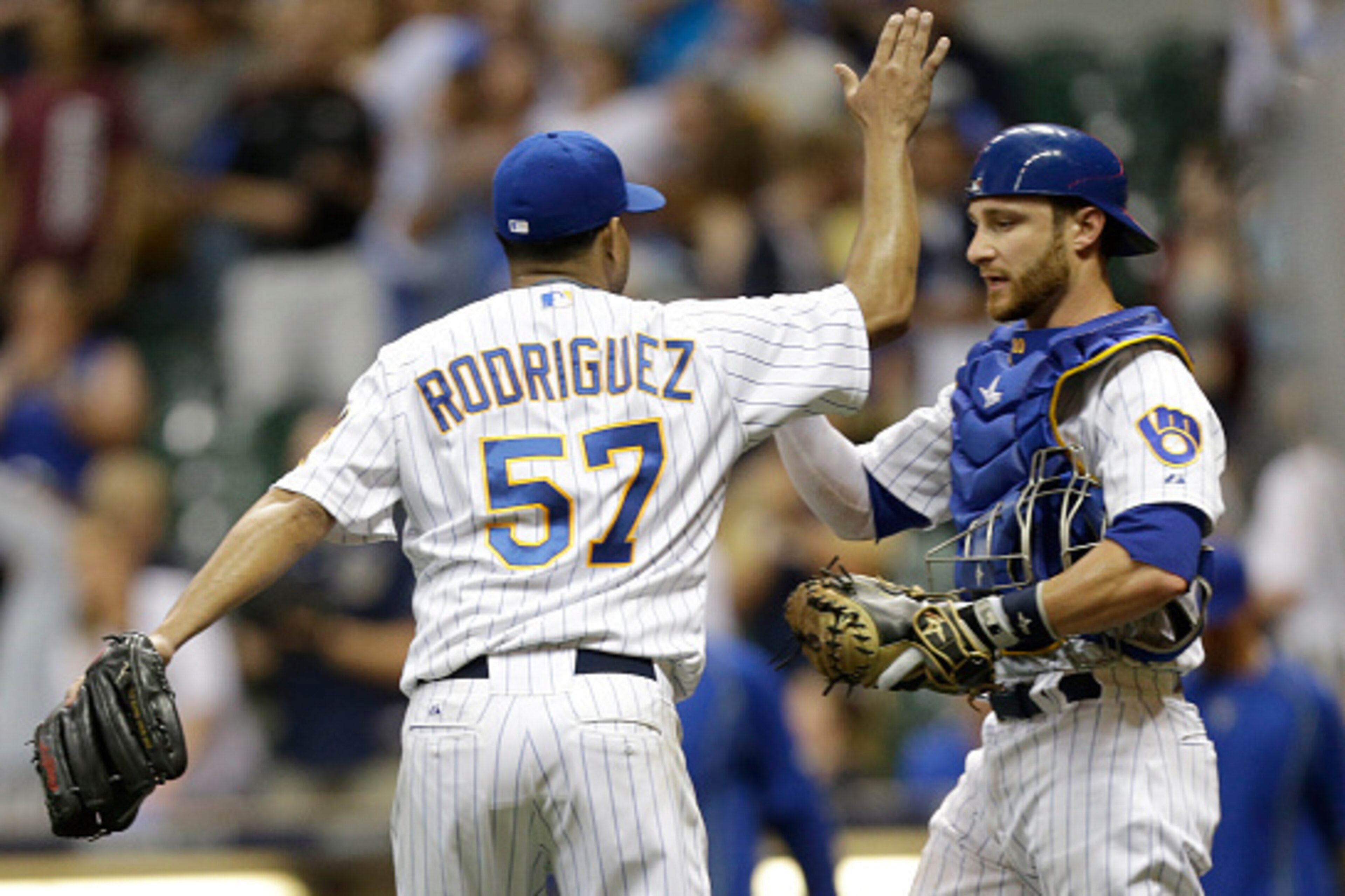 MILWAUKEE, WI - JULY 17: Francisco Rodriguez #57 of the Milwaukee Brewers celebrates with Jonathan Lucroy #20 after the 4-1 win over the Pittsburgh Pirates at Miller Park on July 17, 2015 in Milwaukee, Wisconsin. (Photo by Mike McGinnis/Getty Images)