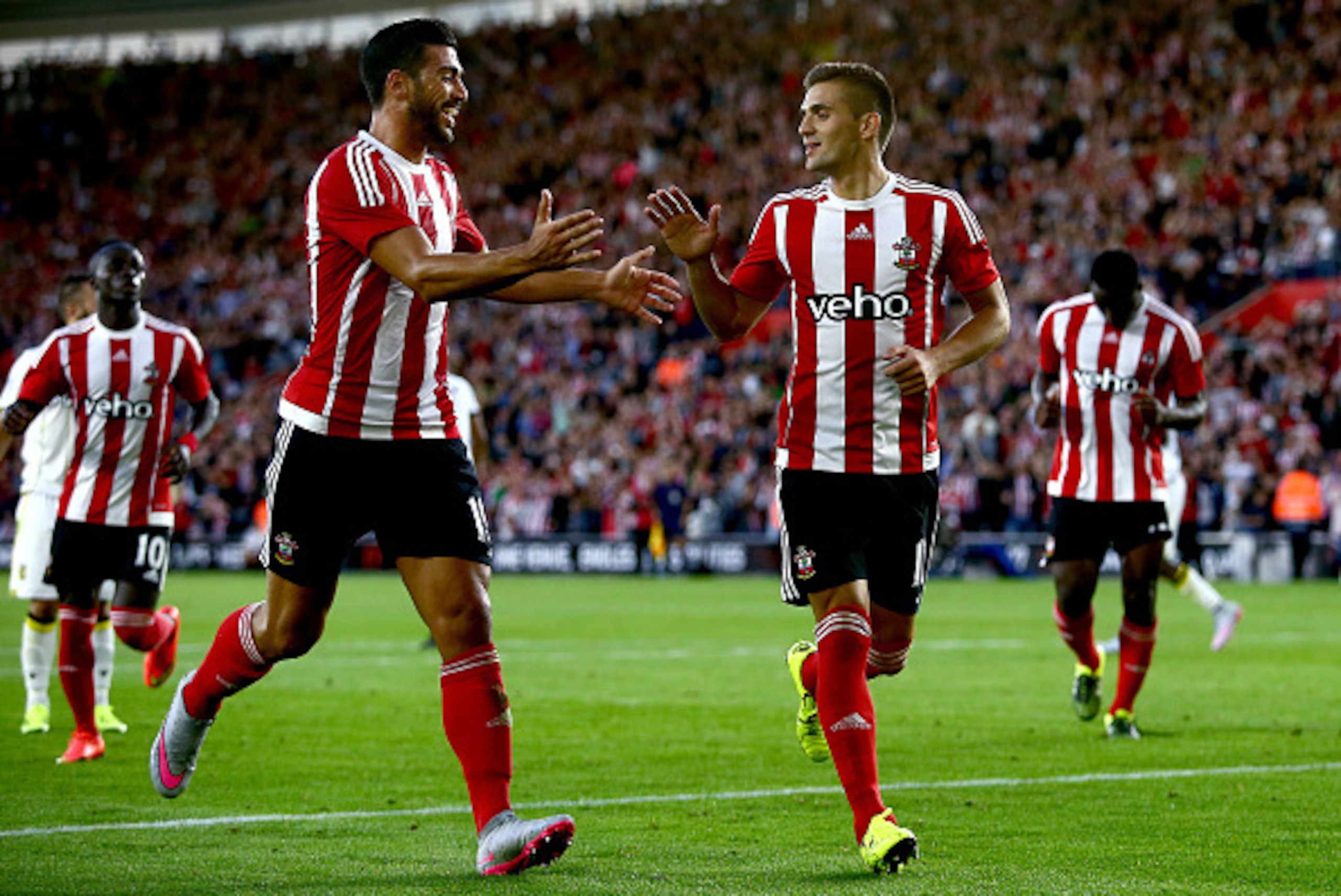 SOUTHAMPTON, ENGLAND - JULY 30:  Graziano Pelle of Southampton (L) congratulates Dusan Tadic of Southampton (R) after he scores from a penalty to make it 2-0 during the UEFA Europa League Third Qualifying Round 1st Leg match between Southampton and Vitess