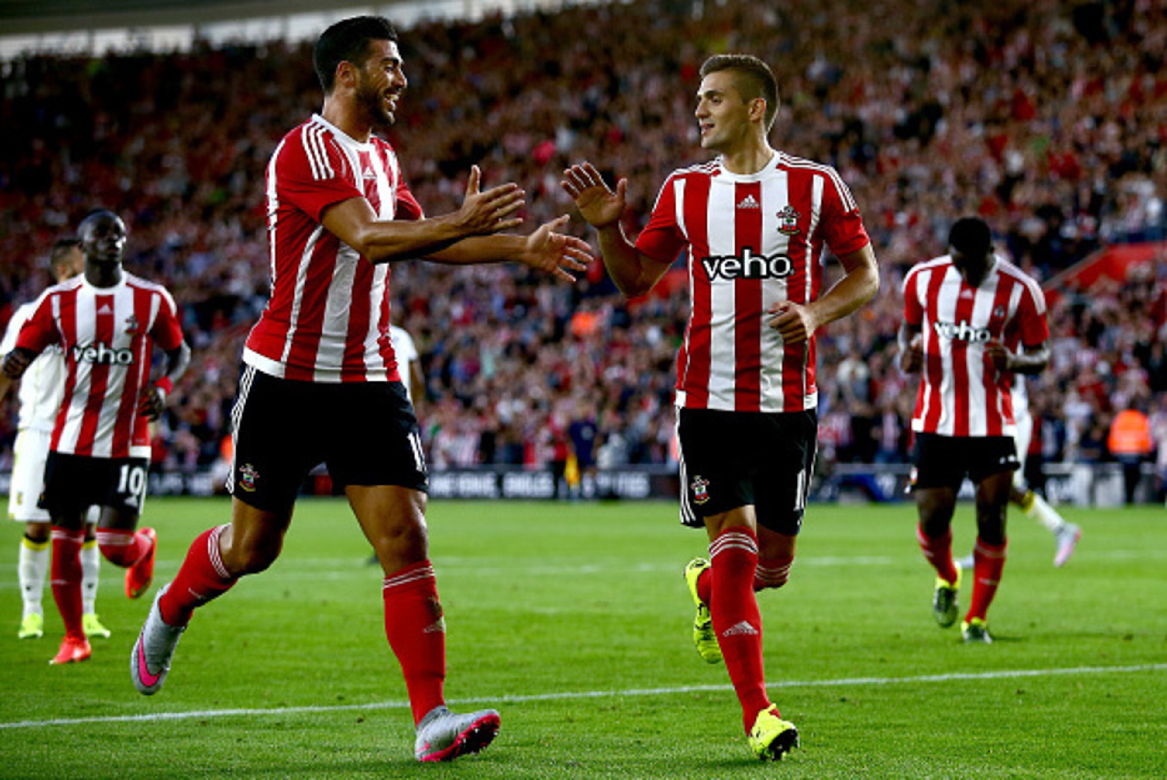 SOUTHAMPTON, ENGLAND - JULY 30:  Graziano Pelle of Southampton (L) congratulates Dusan Tadic of Southampton (R) after he scores from a penalty to make it 2-0 during the UEFA Europa League Third Qualifying Round 1st Leg match between Southampton and Vitess