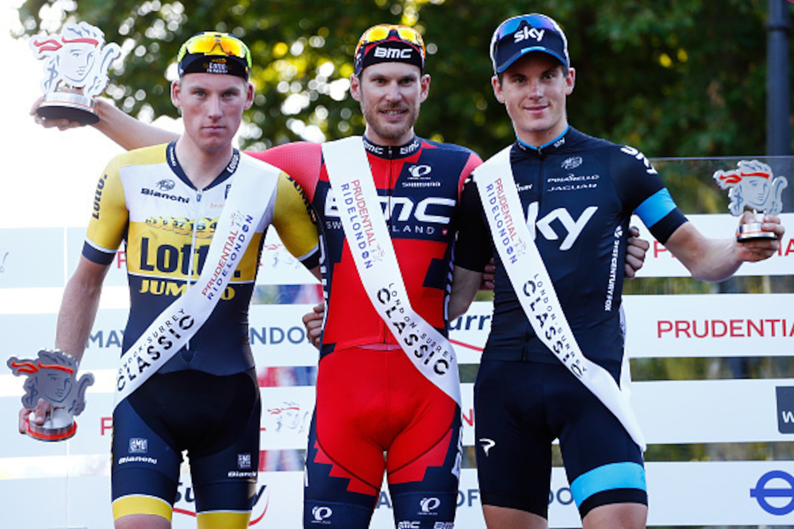 LONDON, ENGLAND - AUGUST 02: (L-R) Second place Mike Teunissen of Team Lotto NL-Jumbo, winner Jean Pierre Drucker of BMC Racing Team and third place Ben Swift of Team Sky stand on podium following the Prudential RideLondon Surrey Classic, a 200km route th