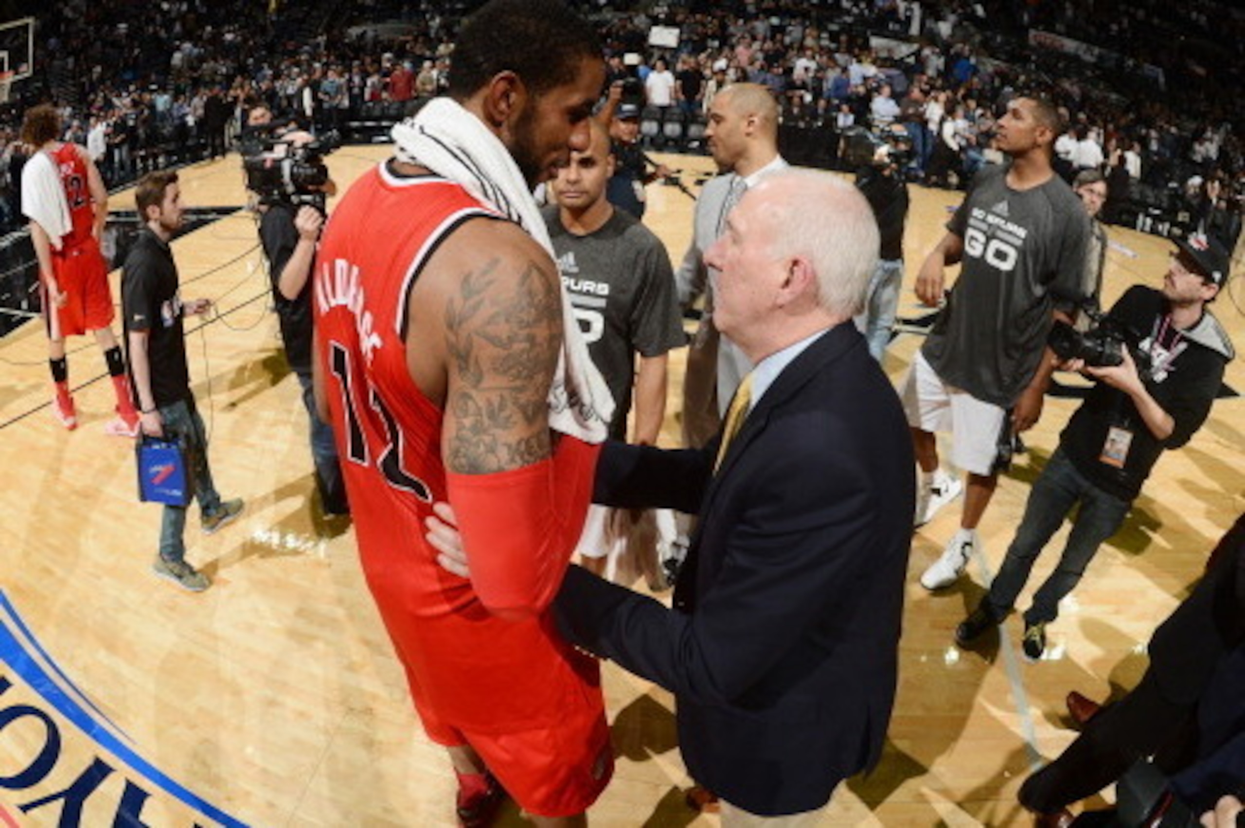 SAN ANTONIO, TX - MAY 14: Gregg Popovich of the San Antonio Spurs greets LaMarcus Aldridge #12 of the Portland Trail Blazers after Game Five of the Western Conference Semifinals during the 2014 NBA Playoffs on May 14, 2014 at the AT&T Center in San Antoni