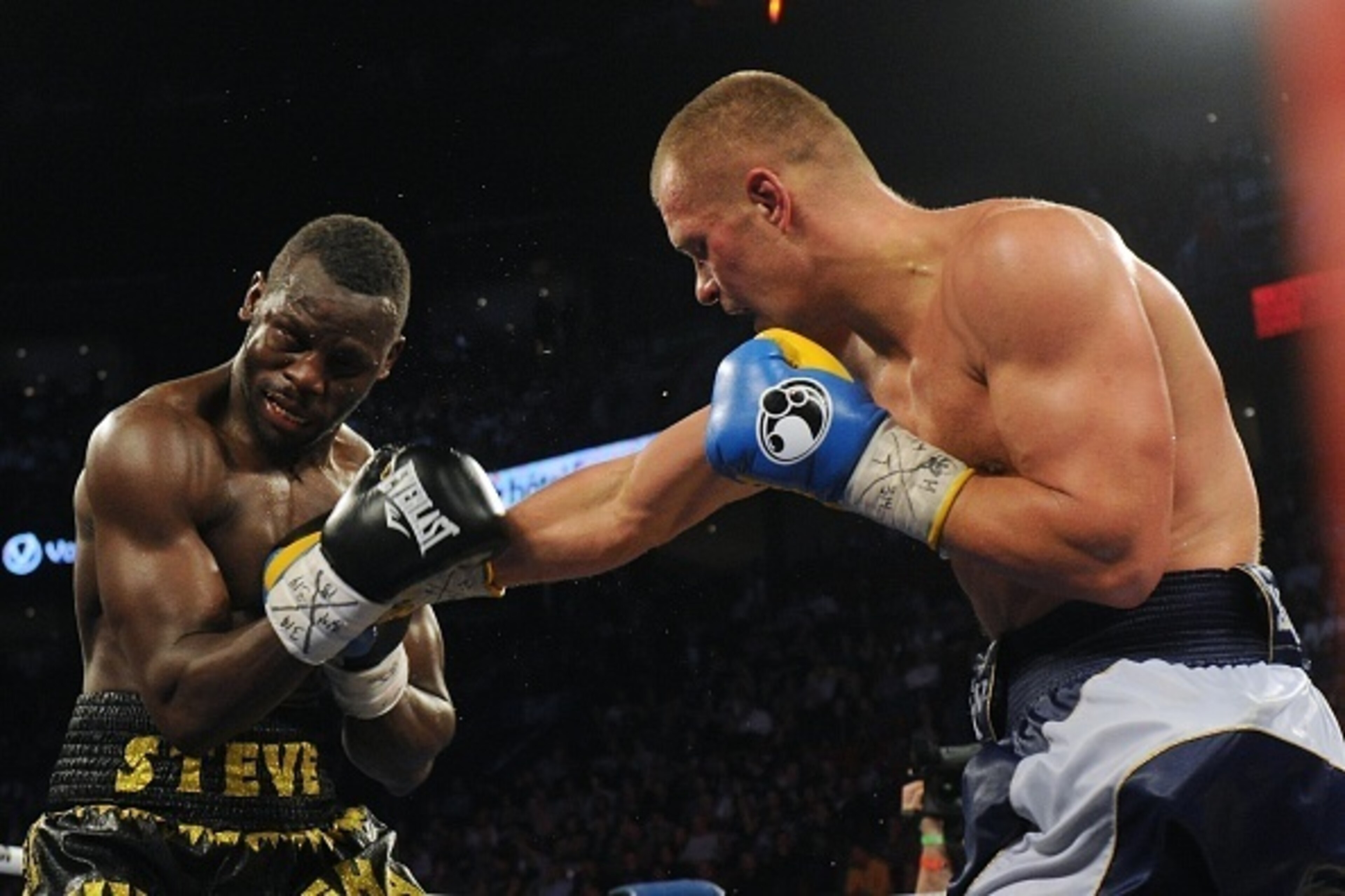 MONTREAL, QC - MARCH 14:  Vyacheslav Glazkov (right) connects with the head of Steve Cunningham during the undercard fight prior to the Sergey Kovalev versus Jean Pascal main event at the Bell Centre on March 14, 2015 in Montreal, Quebec, Canada.  (Photo 