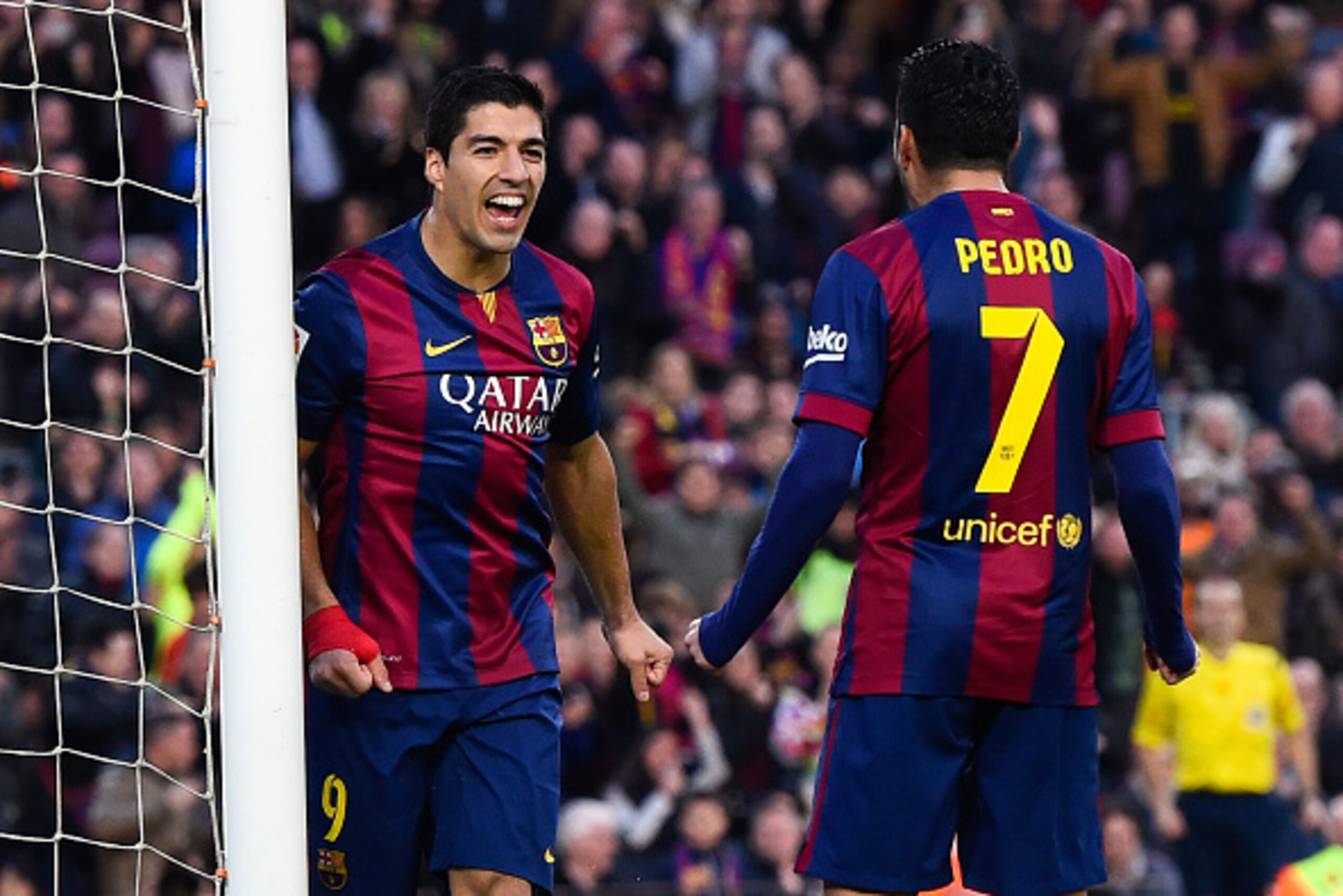BARCELONA, SPAIN - DECEMBER 20:  Luis Suarez of FC Barcelona celebrates with his teammate Pedro Rodriguez of FC Barcelona after scoring his team's second goalduring the La Liga match between FC Barcelona and Cordoba CF at Camp Nou on December 20, 2014 in 