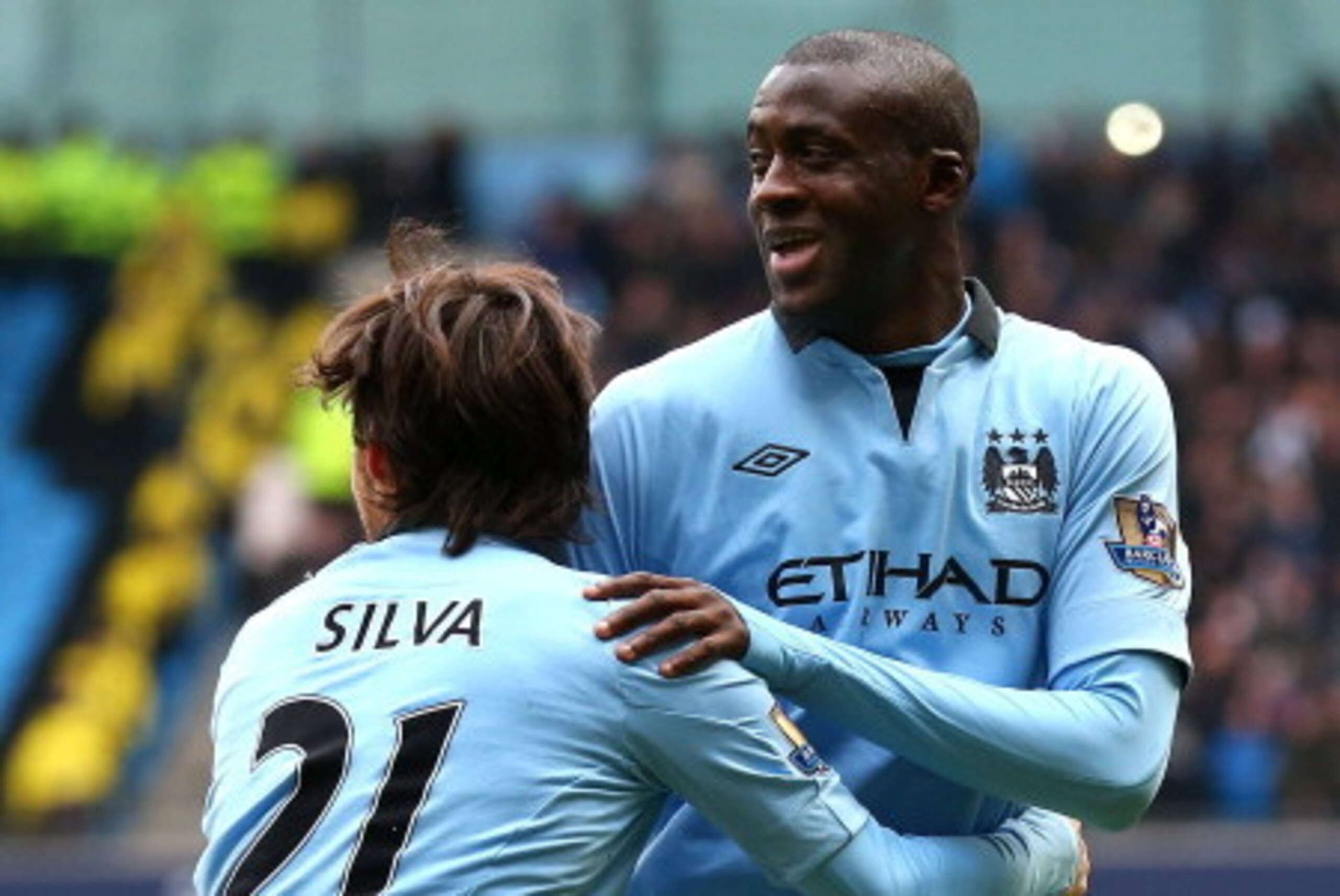 MANCHESTER, ENGLAND - FEBRUARY 24: Yaya Toure of Manchester City celebrates with David Silva after scoring the opening goal during the Barclays Premier League match between Manchester City and Chelsea at Etihad Stadium on February 24, 2013 in Manchester, MANCHESTER, ENGLAND - FEBRUARY 24: Yaya Toure of Manchester City celebrates with David Silva after scoring the opening goal during the Barclays Premier League match between Manchester City and Chelsea at Etihad Stadium on February 24, 2013 in Manchester,