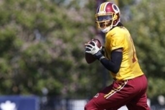 Aug 1, 2015; Richmond, VA, USA; Washington Redskins quarterback Robert Griffin III (10) prepares to throw the ball during afternoon practice as part of day three of training camp at Bon Secours Washington Redskins Training Center. Mandatory Credit: Geoff 