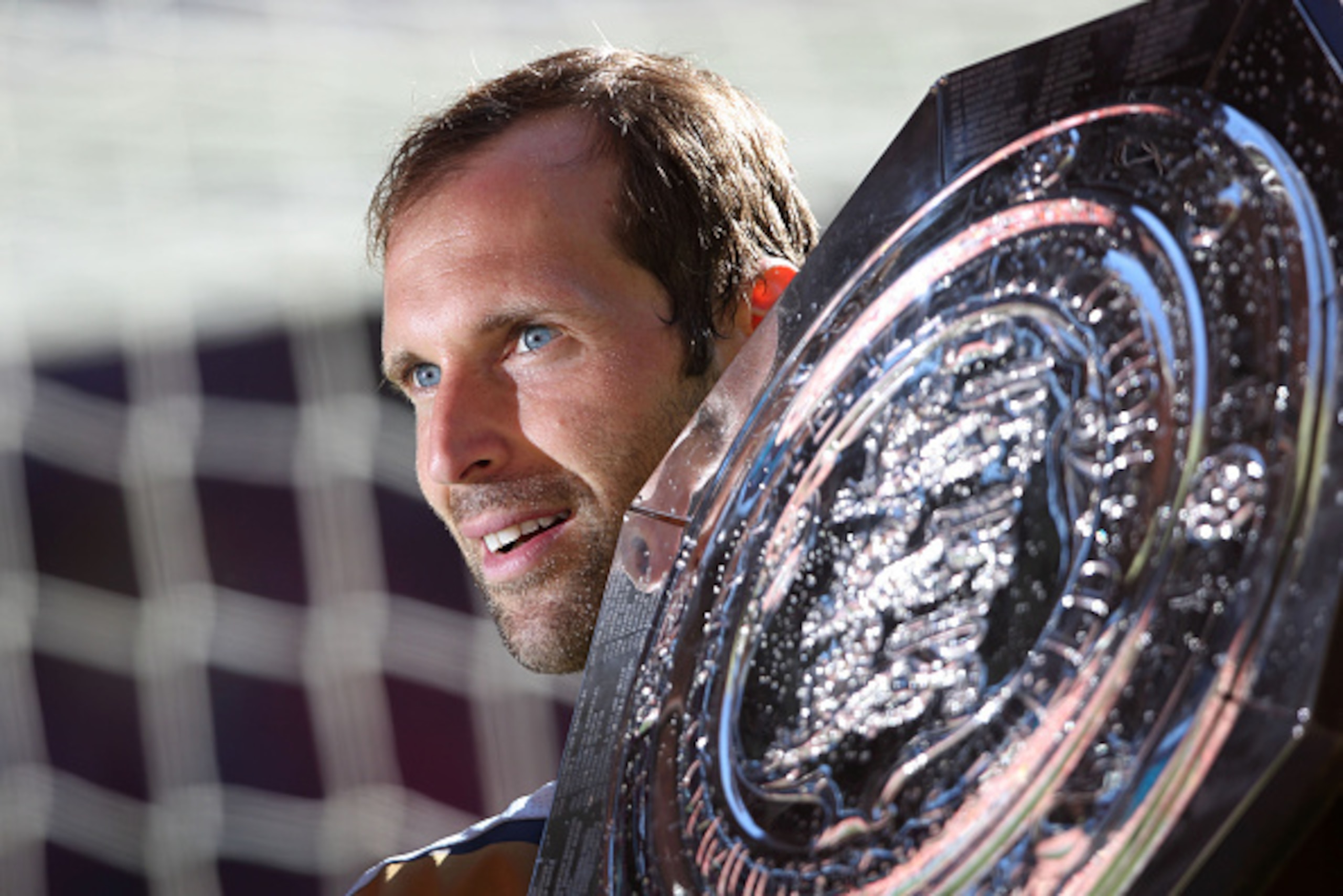 LONDON, ENGLAND - AUGUST 02:  LONDON, ENGLAND -  AUGUST 2:  (Re-transmission of image #482762270 with alternative crop) Goalkeeper Petr Cech of Arsenal poses with the FA Community Shield trophy after the FA Community Shield match between Chelsea and Arsen