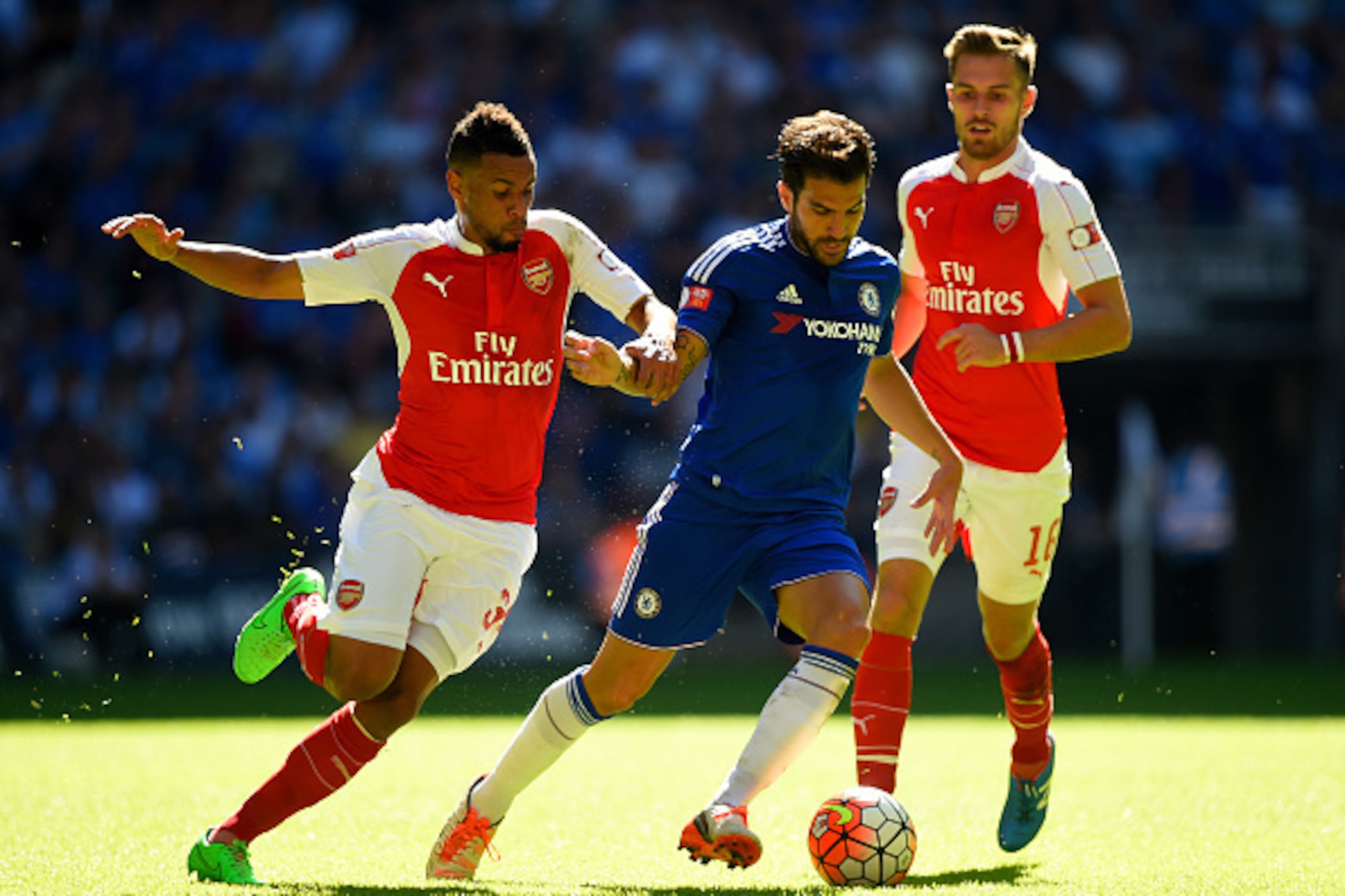LONDON, ENGLAND - AUGUST 02:  Cesc Fabregas of Chelsea battles for the ball with Francis Coquelin of Arsenal and Aaron Ramsey of Arsenal during the FA Community Shield match between Chelsea and Arsenal at Wembley Stadium on August 2, 2015 in London, Engla