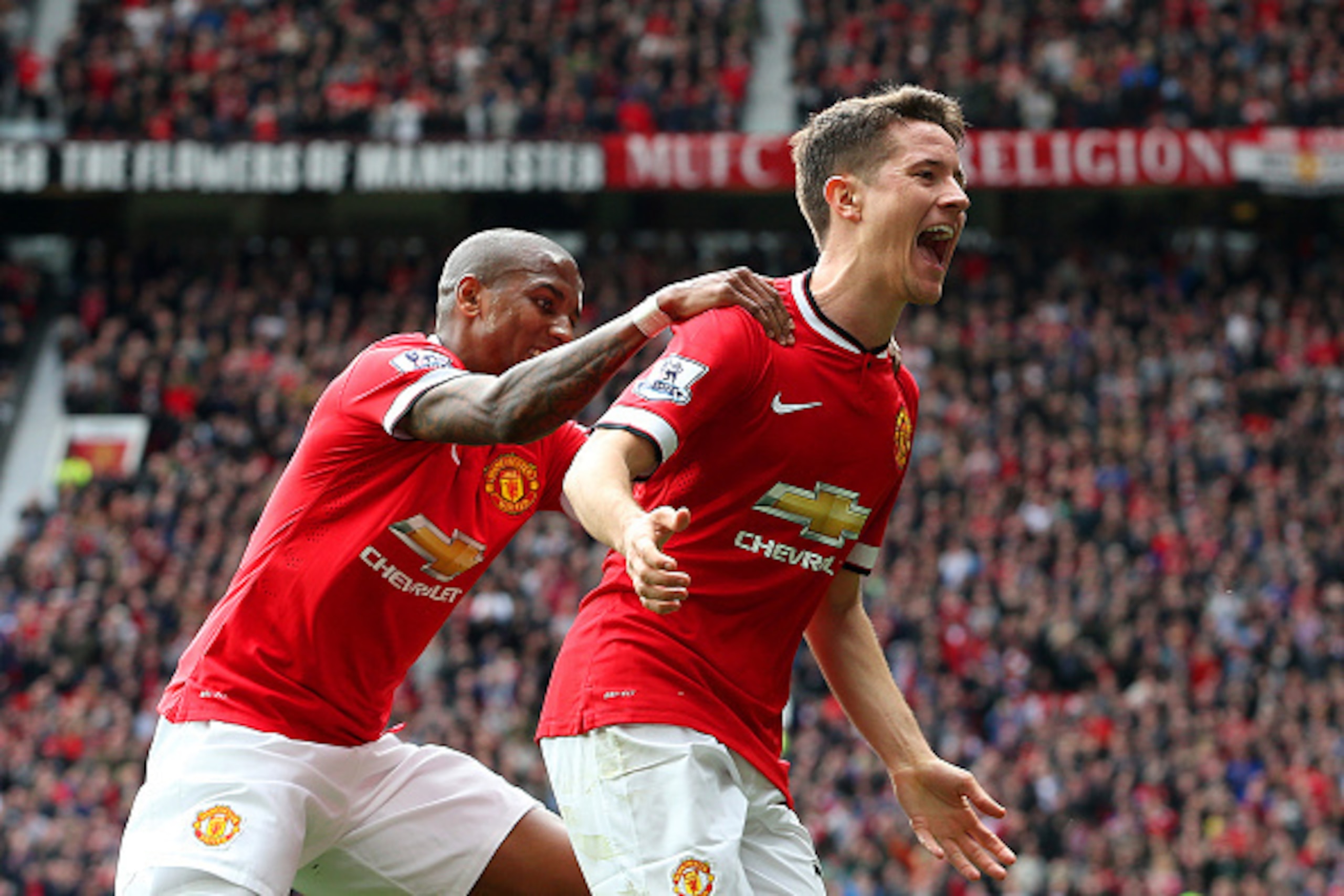 MANCHESTER, ENGLAND - APRIL 04:  Ander Herrera of Manchester United celebrates with team-mate Ashley Young of Manchester United after scoring the opening goal during the Barclays Premier League match between Manchester United and Aston Villa at Old Traffo