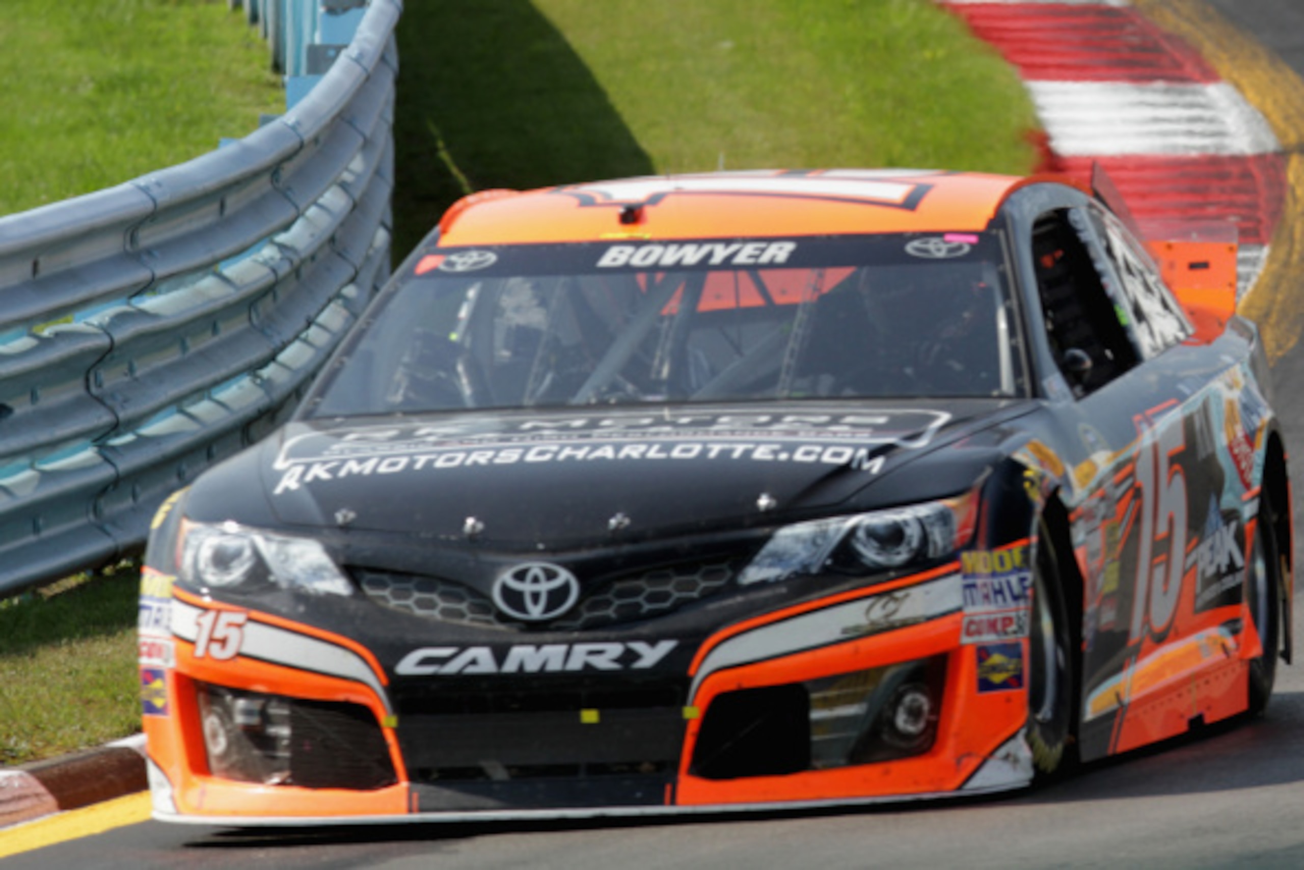 WATKINS GLEN, NY - AUGUST 10:  Clint Bowyer, driver of the #15 RK Motors Charlotte Toyota, races the NASCAR Sprint Cup Series Cheez-It 355 at Watkins Glen International on August 10, 2014 in Watkins Glen, New York.  (Photo by Jerry Markland/Getty Images)