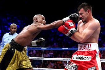 World Boxing Council champion Floyd Mayweather (L) and Robert Guerrero exchange punches during their fight at the MGM Grand Garden Arena in Las Vegas on May 4, 2013.  Mayweather extended his perfect record to 44 victories, beating Robert Guerrero by unani