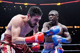 ONTARIO, CA - MARCH 13: Andre Berto (R) lands a punch against Josesito Lopez during their 12 round welterweight bout at Citizens Business Bank Arena March 13, 2015 in Ontario, California. Berto won by knock out. (Photo by Kevork Djansezian/Getty Images)