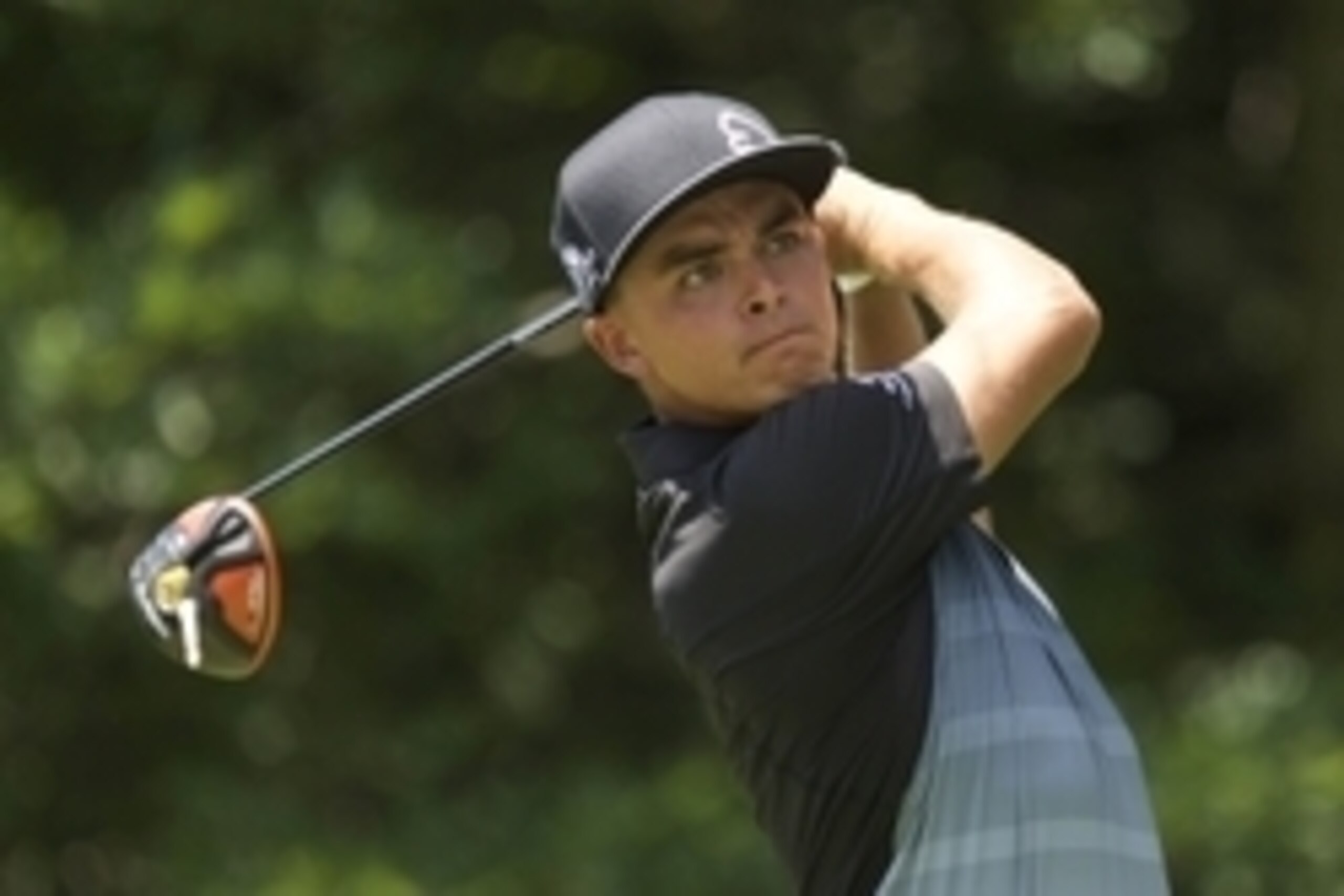 Jul 31, 2015; Gainesville, VA, USA; Rickie Fowler watches his drive on the 3rd hole in the second round of the Quicken Loans National golf tournament at Robert Trent Jones Golf Club. Mandatory Credit: Rafael Suanes-USA TODAY Sports