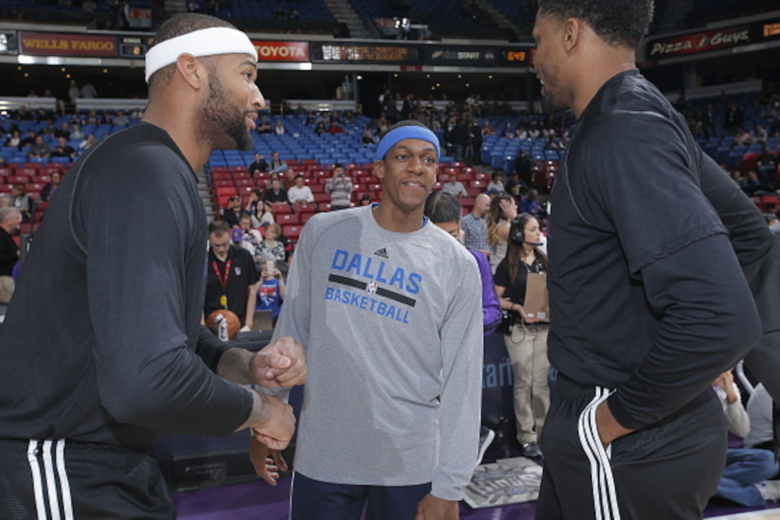 SACRAMENTO, CA - JANUARY 13: Rajon Rondo #9 of the Dallas Mavericks talks to DeMarcus Cousins #15 and Rudy Gay #8 of the Sacramento Kings prior to the game on January 13, 2015 at Sleep Train Arena in Sacramento, California. NOTE TO USER: User expressly ac