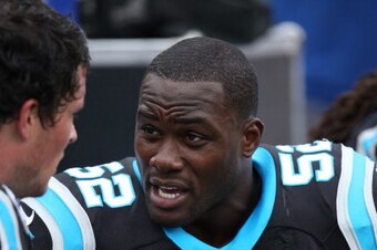 ORCHARD PARK, NY - SEPTEMBER 15: Jon Beason #52 of the Carolina Panthers talks to Luke Kuechly #59 on the bench during NFL game action against the Buffalo Bills at Ralph Wilson Stadium on September 15, 2013 in Orchard Park, New York. (Photo by Tom Szczerb