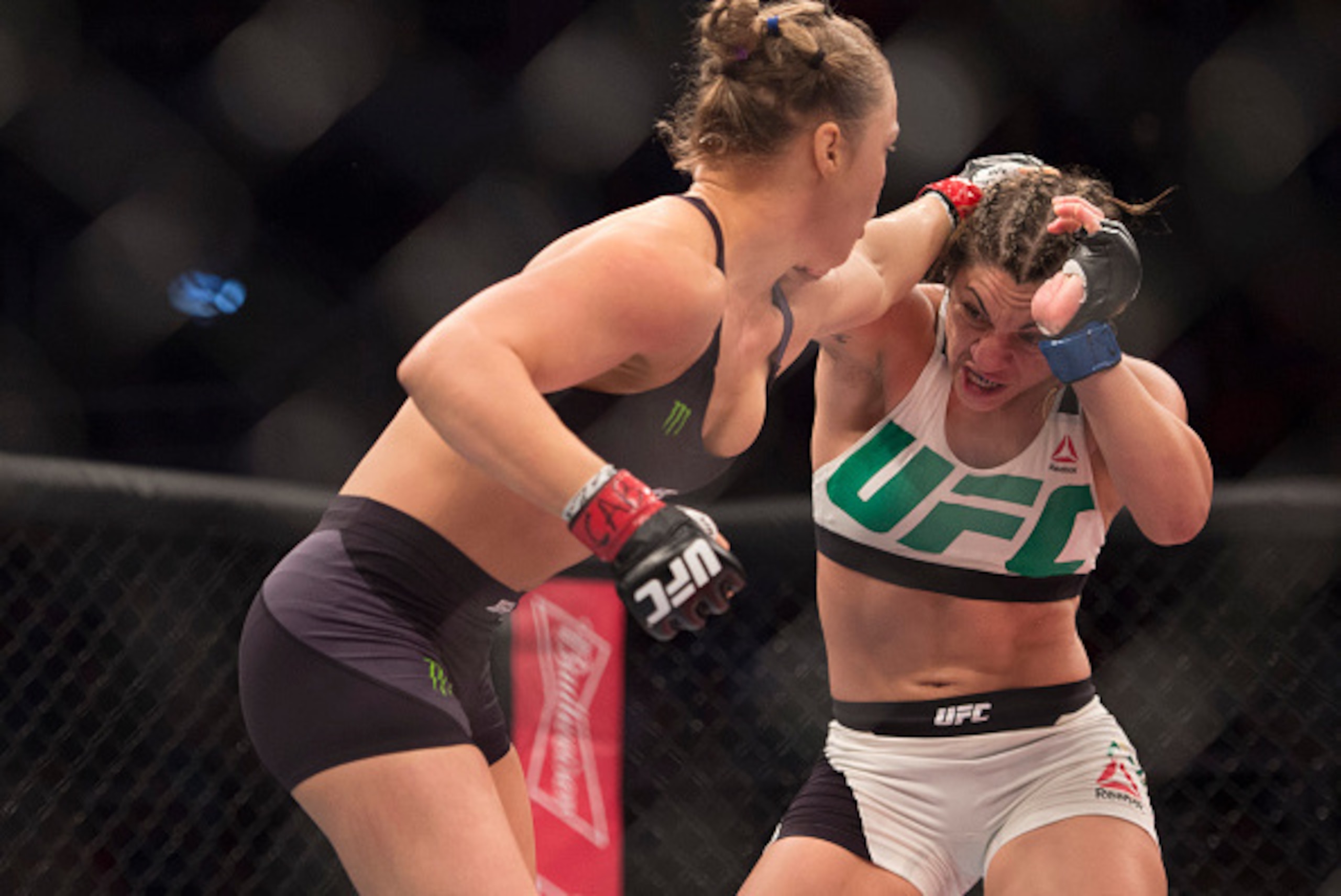 RIO DE JANEIRO, BRAZIL - AUGUST 01:  (L-R) UFC women's bantamweight champion Ronda Rousey punches Bethe Correia of Brazil during the UFC 190 event inside HSBC Arena on August 1, 2015 in Rio de Janeiro, Brazil.  (Photo by Jeff Bottari/Zuffa LLC/Zuffa LLC v