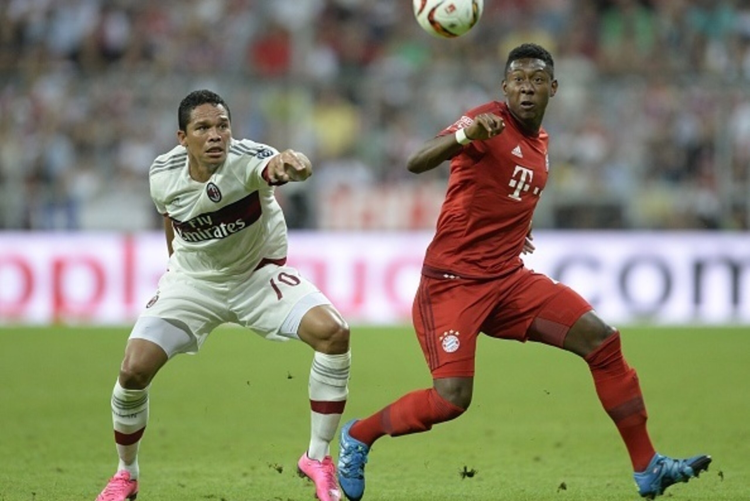 Milan's Japanese defender Keisuka Honda (L) and Bayern Munich's Austrian defender David Alaba (R) vie for the ball during the Audi Cup football match FC Bayern Munich vs AC Milan in Munich, southern Germany, on August 4, 2015. The Audi Cup football matche