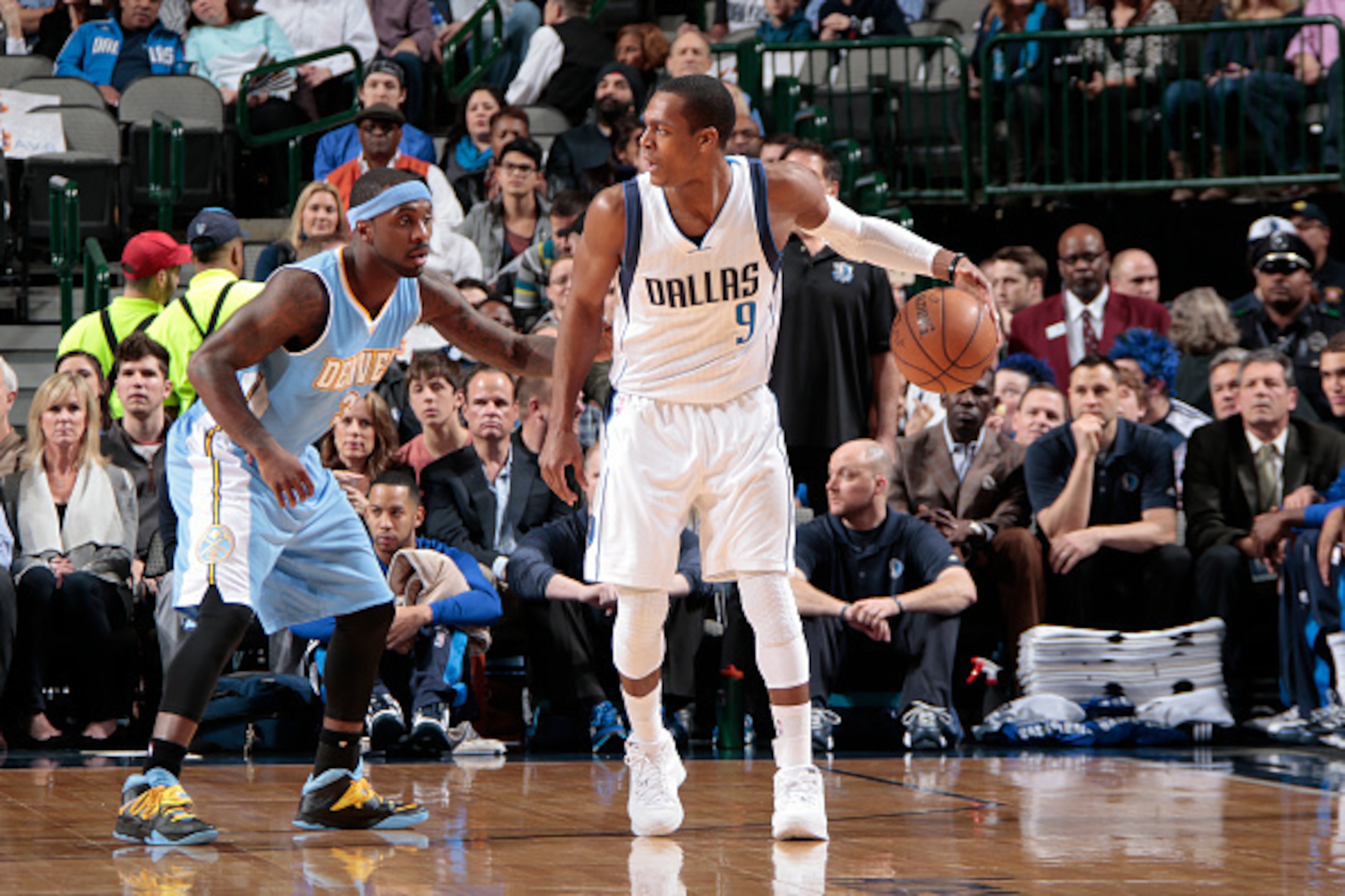 DALLAS, TX - JANUARY 16: Rajon Rondo #9 of the Dallas Mavericks handles the ball against Ty Lawson #3 of the Denver Nuggets during the game on January 16, 2015 at the American Airlines Center in Dallas, Texas. NOTE TO USER: User expressly acknowledges and