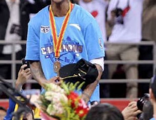 Marbury after cutting the net as this year's champion, while being named Finals MVP.