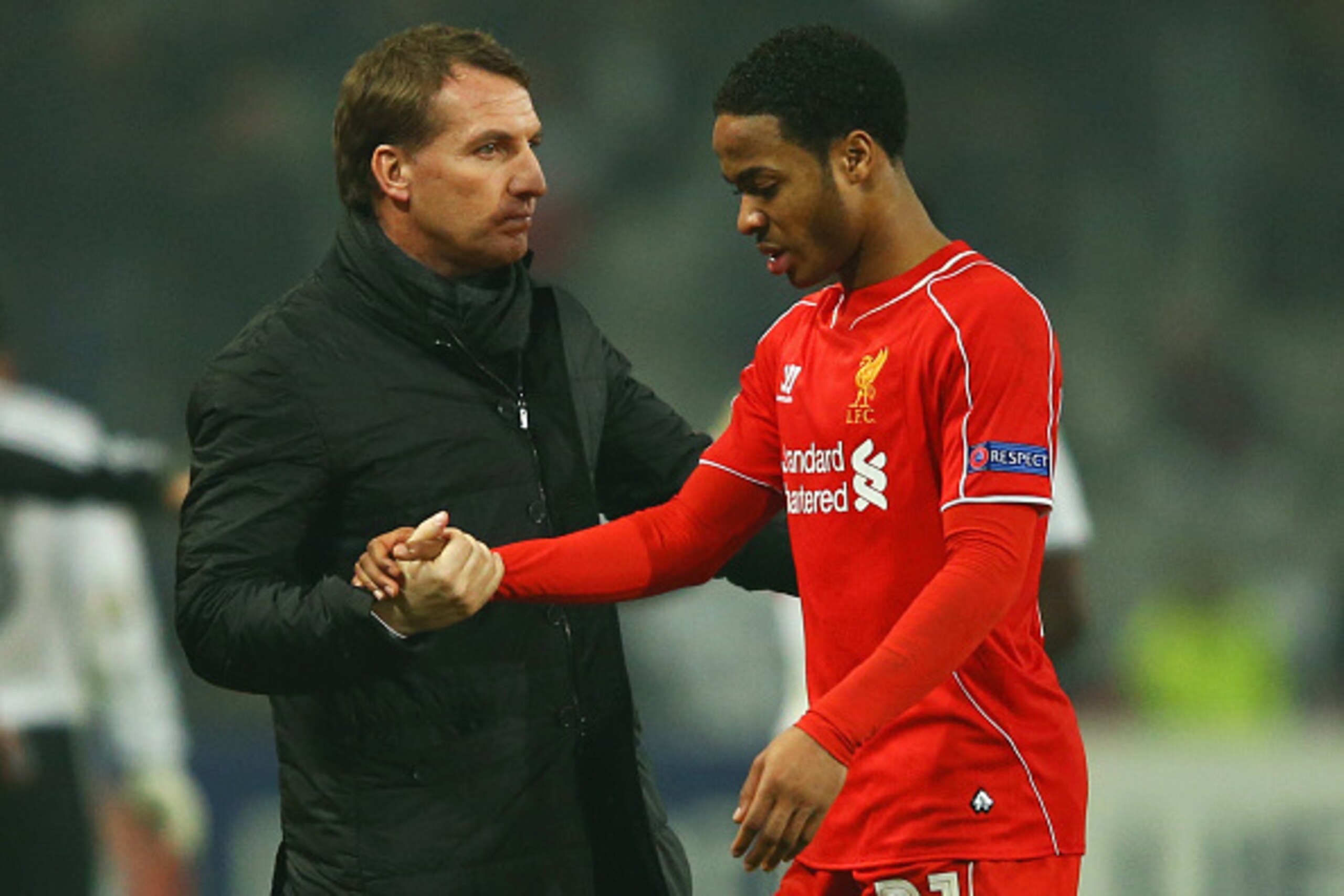 ISTANBUL, TURKEY - FEBRUARY 26:  Brendan Rodgers manager of Liverpool shakes hands with Raheem Sterling of Liverpool after defeat in a penalty shoot out during the UEFA Europa League Round of 32 second leg match between Besiktas JK and Liverpool FC on Feb