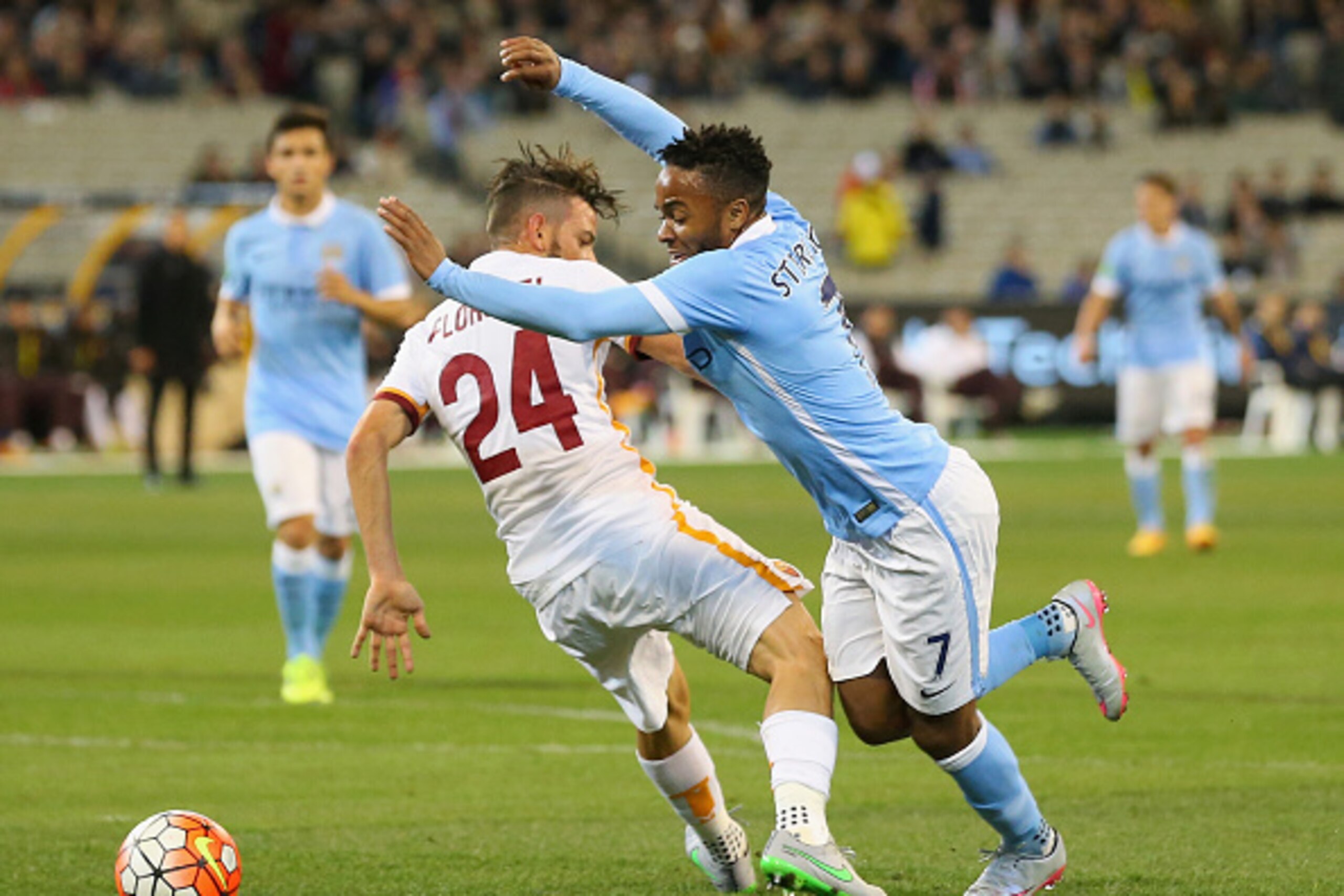 MELBOURNE, AUSTRALIA - JULY 21:  Raheem Sterling of Manchester City is tackled by Alessandro Florenzi of AS Roma during the International Champions Cup friendly match between Manchester City and AS Roma at the Melbourne Cricket Ground on July 21, 2015 in 
