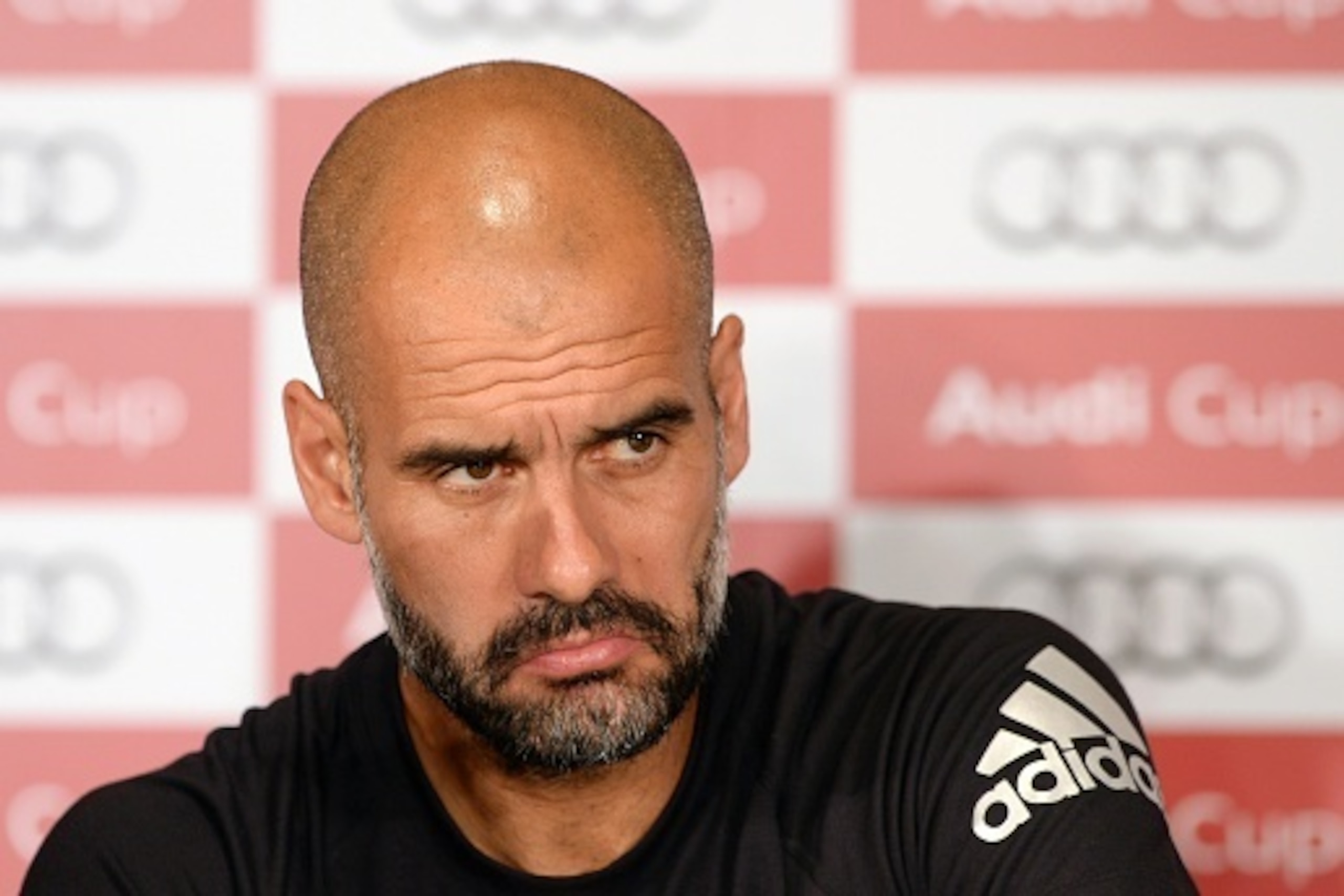 Bayern Munich's Spanish headcoach Pep Guardiola addresses a press conference on the football Audi Cup in Munich, southern Germany, on August 3, 2015. The Audi Cup football matches with Bayern Munich of Germany, Real Madrid of Spain, AC Milan of Italy and 