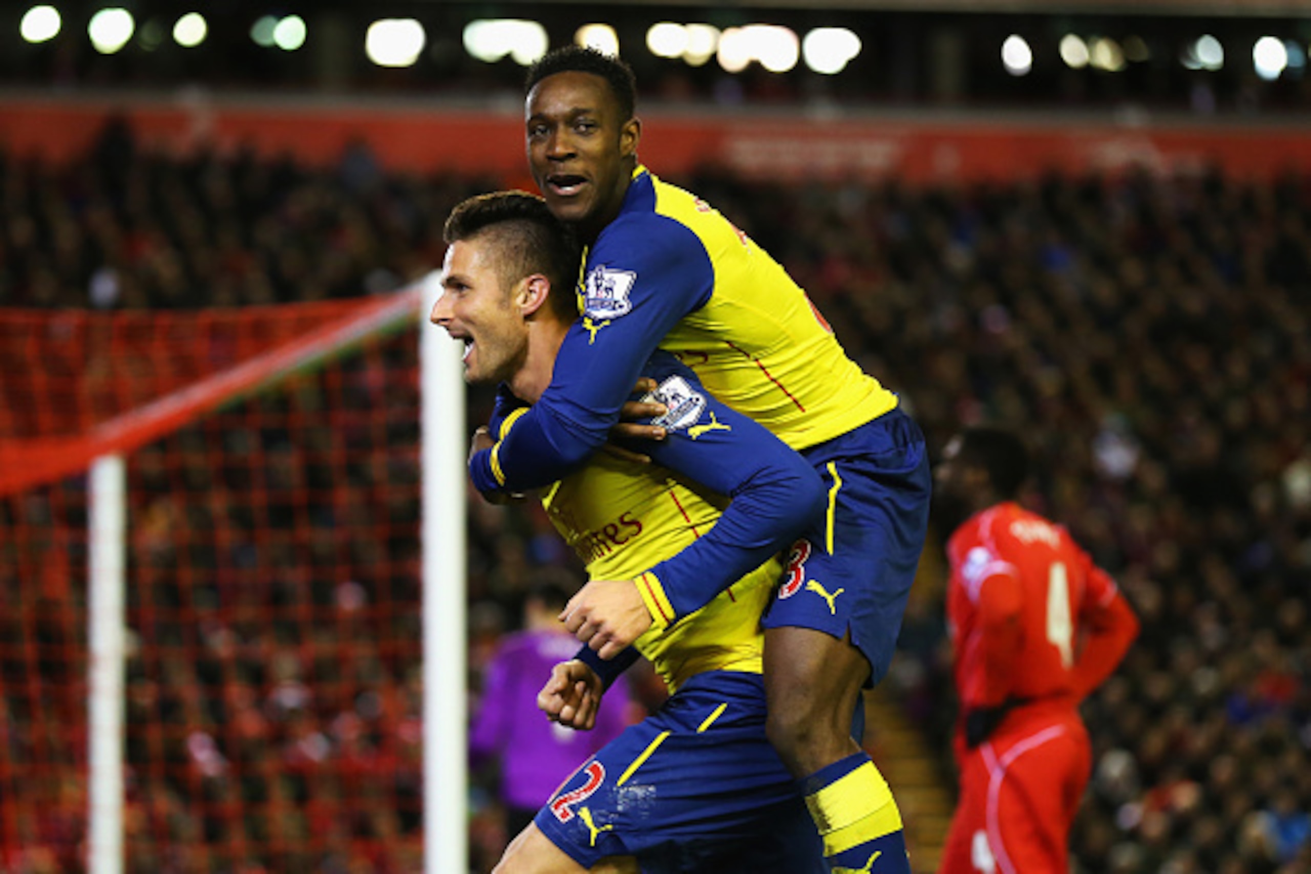 LIVERPOOL, ENGLAND - DECEMBER 21: Olivier Giroud of Arsenal celebrates scoring his goal with Danny Welbeck of Arsenal during the Barclays Premier League match between Liverpool and Arsenal at Anfield on December 21, 2014 in Liverpool, England. (Photo by LIVERPOOL, ENGLAND - DECEMBER 21: Olivier Giroud of Arsenal celebrates scoring his goal with Danny Welbeck of Arsenal during the Barclays Premier League match between Liverpool and Arsenal at Anfield on December 21, 2014 in Liverpool, England. (Photo by