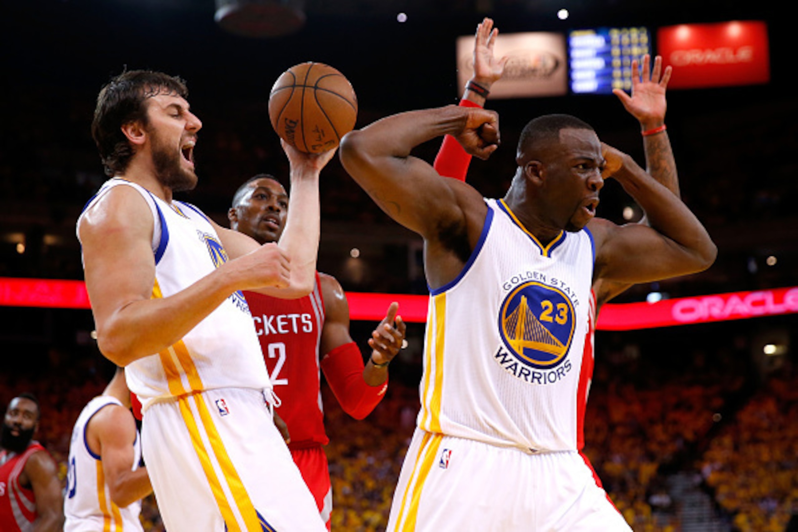 OAKLAND, CA - MAY 27:  Draymond Green #23 of the Golden State Warriors reacts alongside teammate Andrew Bogut #12 in the second half against the Houston Rockets during game five of the Western Conference Finals of the 2015 NBA Playoffs at ORACLE Arena on 