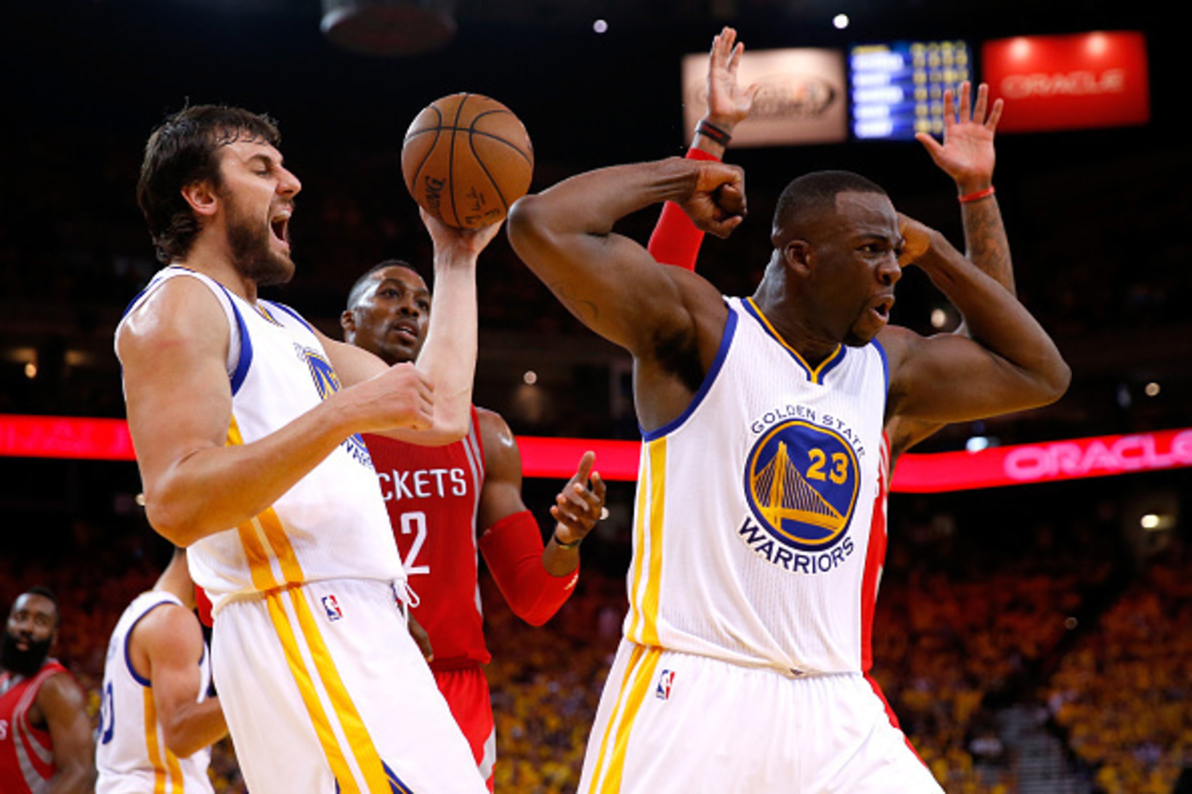 OAKLAND, CA - MAY 27:  Draymond Green #23 of the Golden State Warriors reacts alongside teammate Andrew Bogut #12 in the second half against the Houston Rockets during game five of the Western Conference Finals of the 2015 NBA Playoffs at ORACLE Arena on 