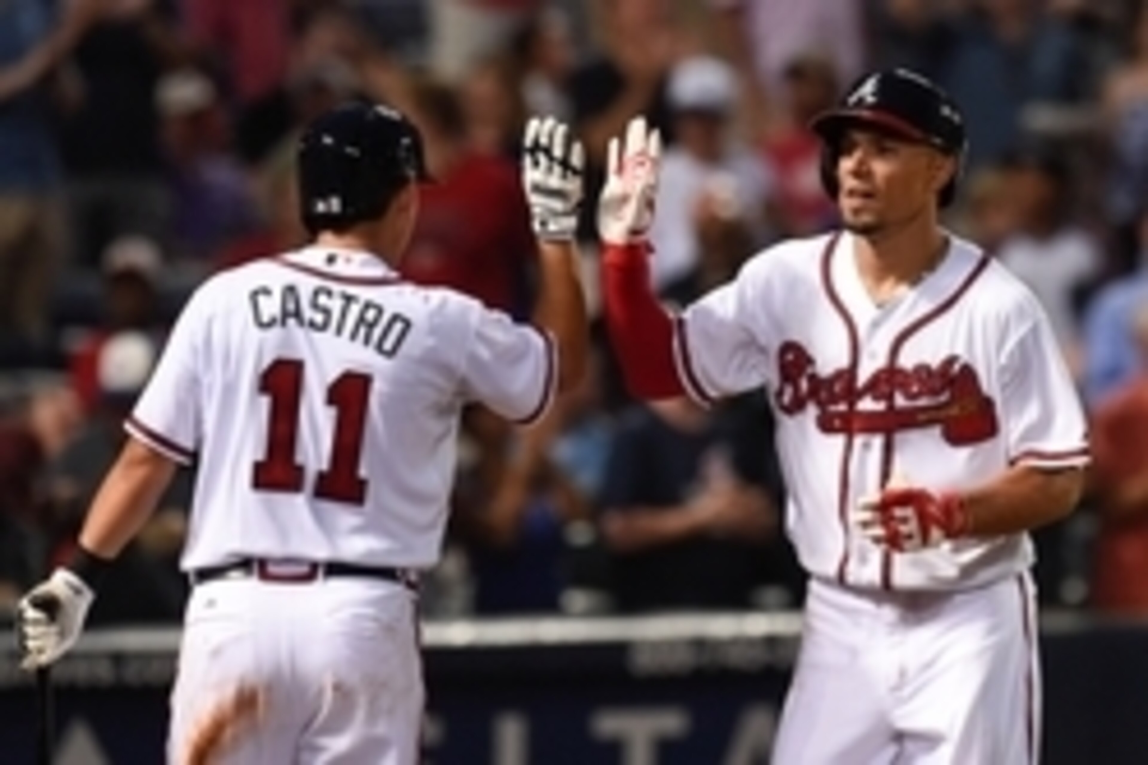 Aug 3, 2015; Atlanta, GA, USA; Atlanta Braves second baseman Jace Peterson (8) high fives with shortstop Daniel Castro (11) after hitting a three run home run against the San Francisco Giants during the sixth inning at Turner Field. Mandatory Credit: Dale
